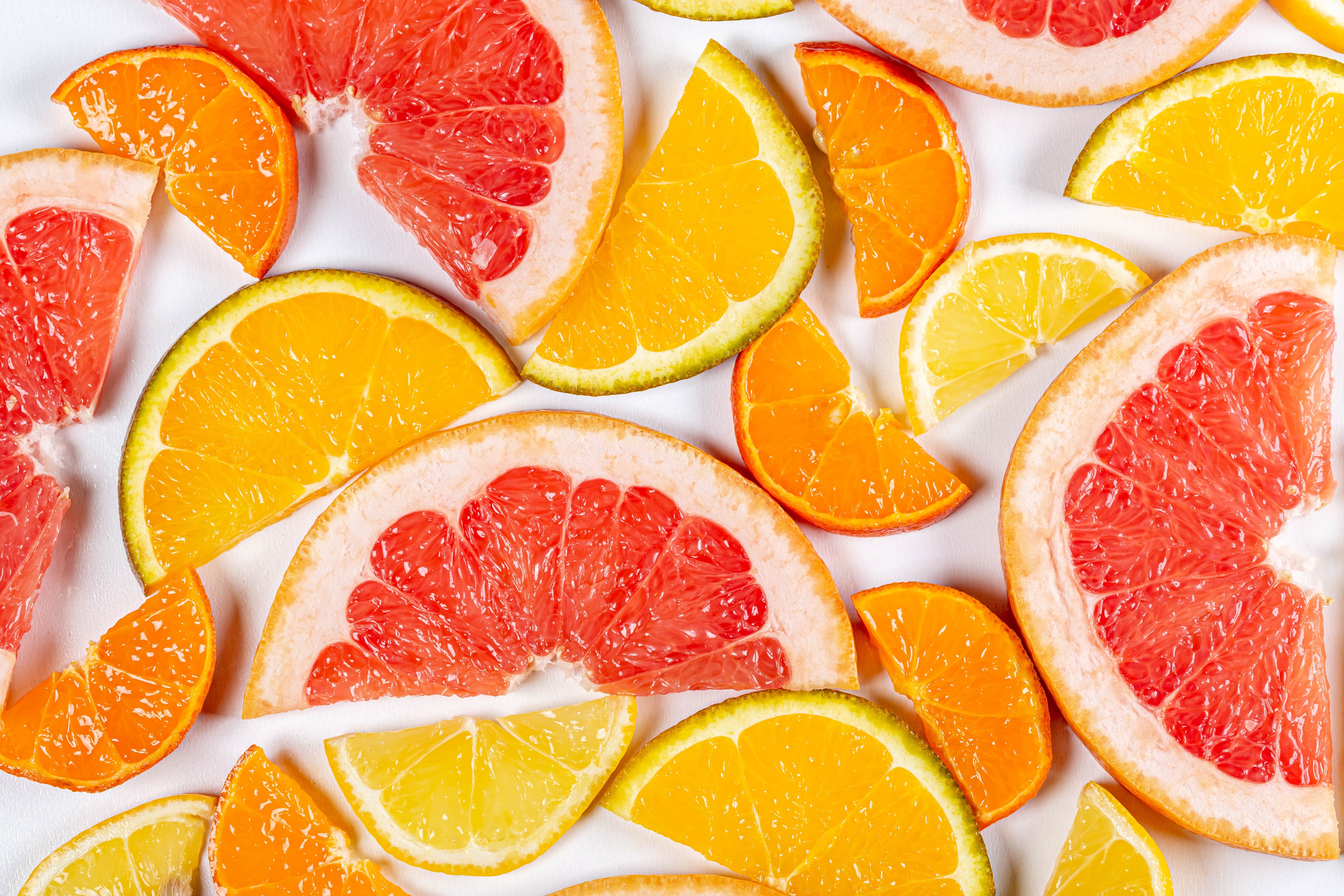 Citrus fruit slices: oranges, grapefruits, and lemons HD Wallpaper