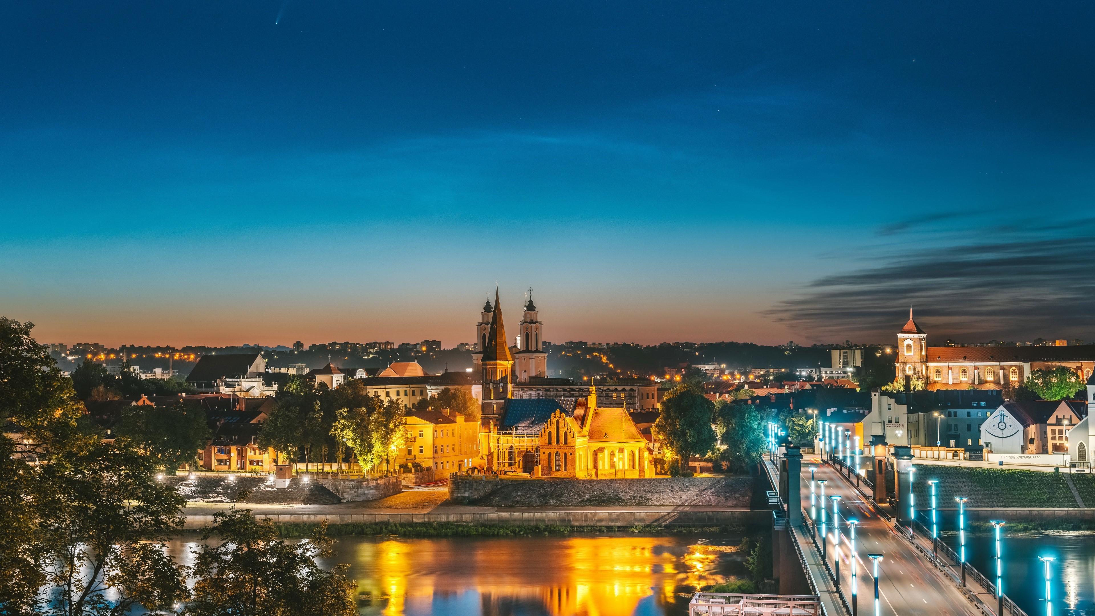 Kaunas cityscape with bridge and churches at night HD Wallpaper