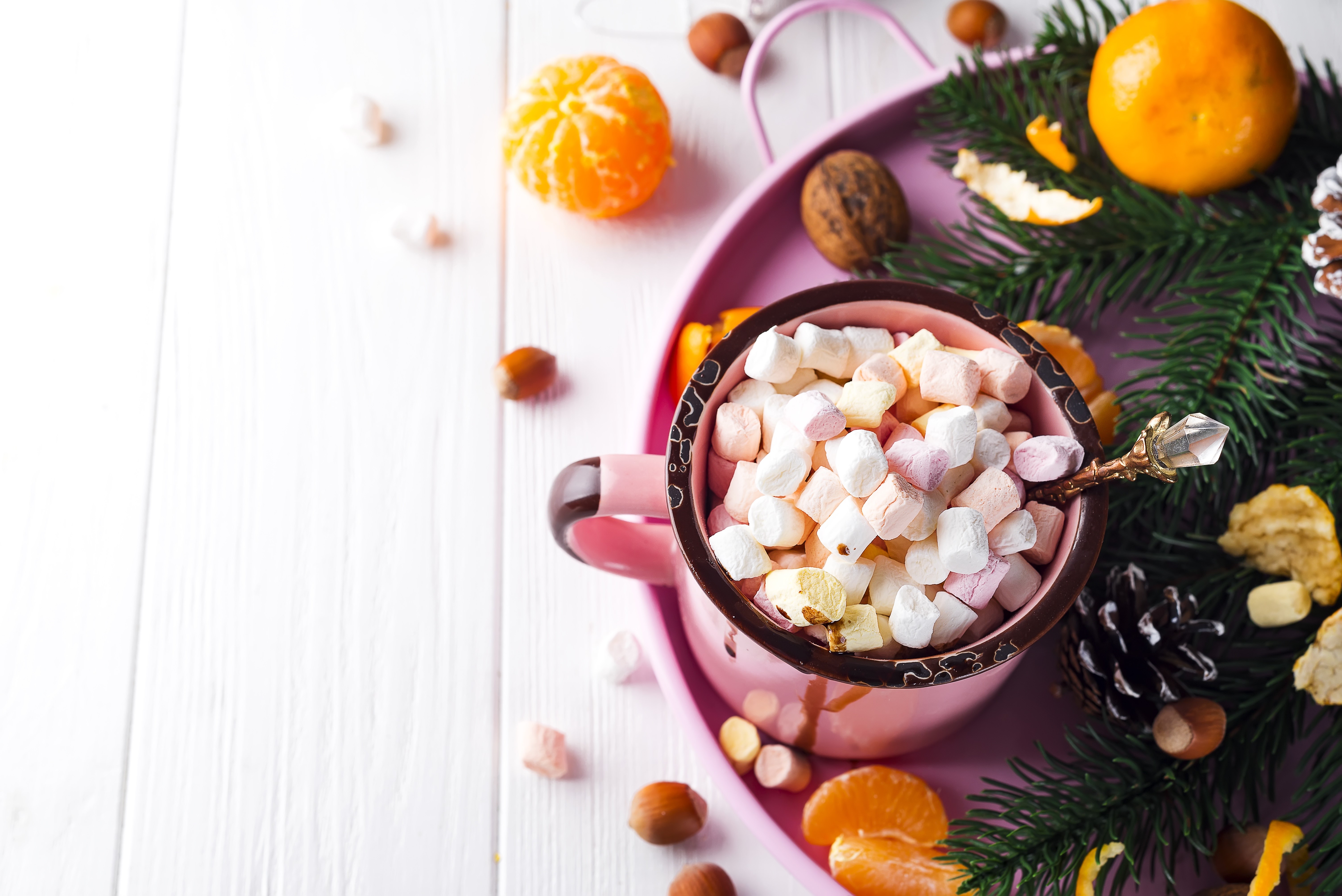 Christmas mug with marshmallows, tangerines, and fir branches HD Wallpaper