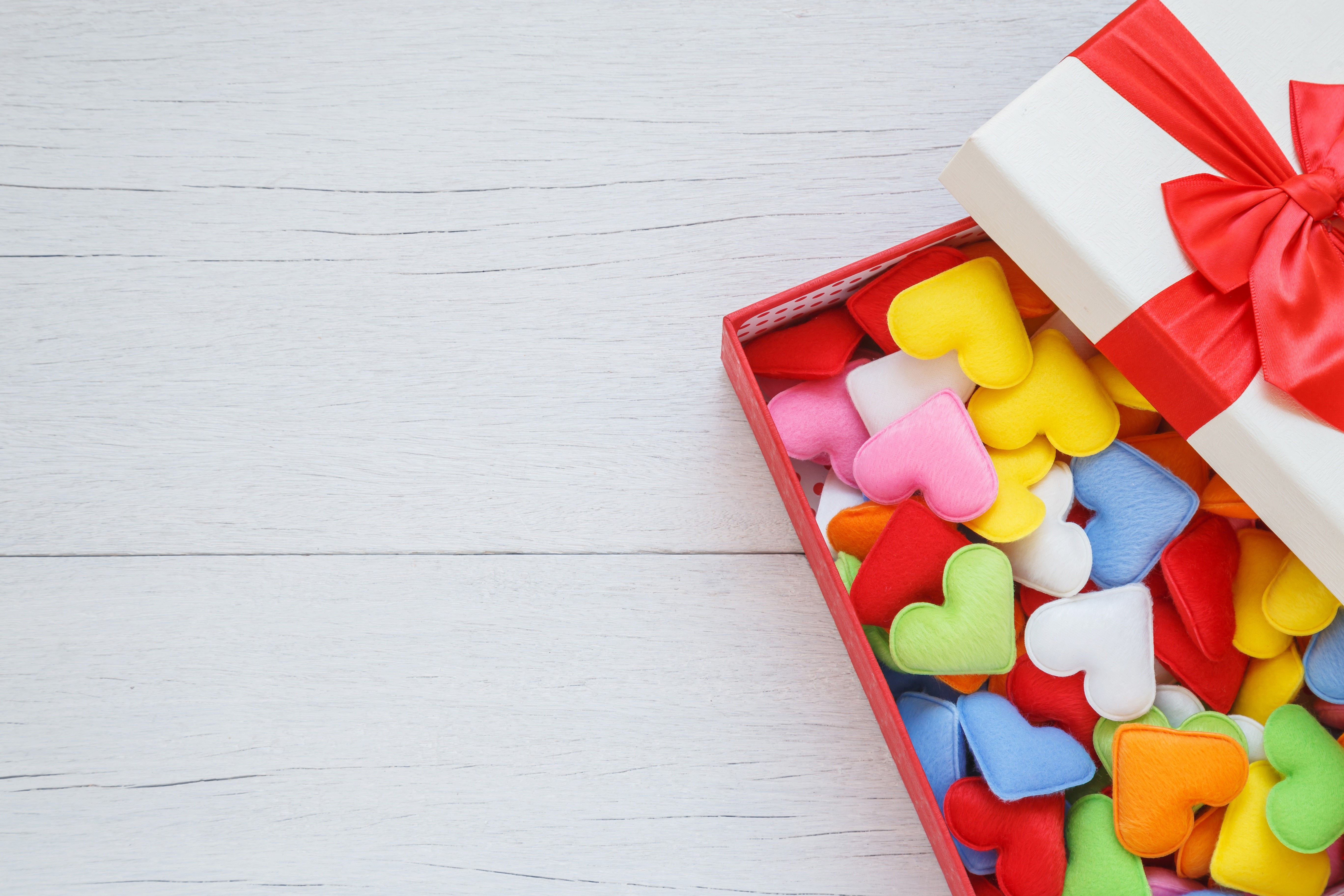 Gift box filled with colorful hearts HD Wallpaper