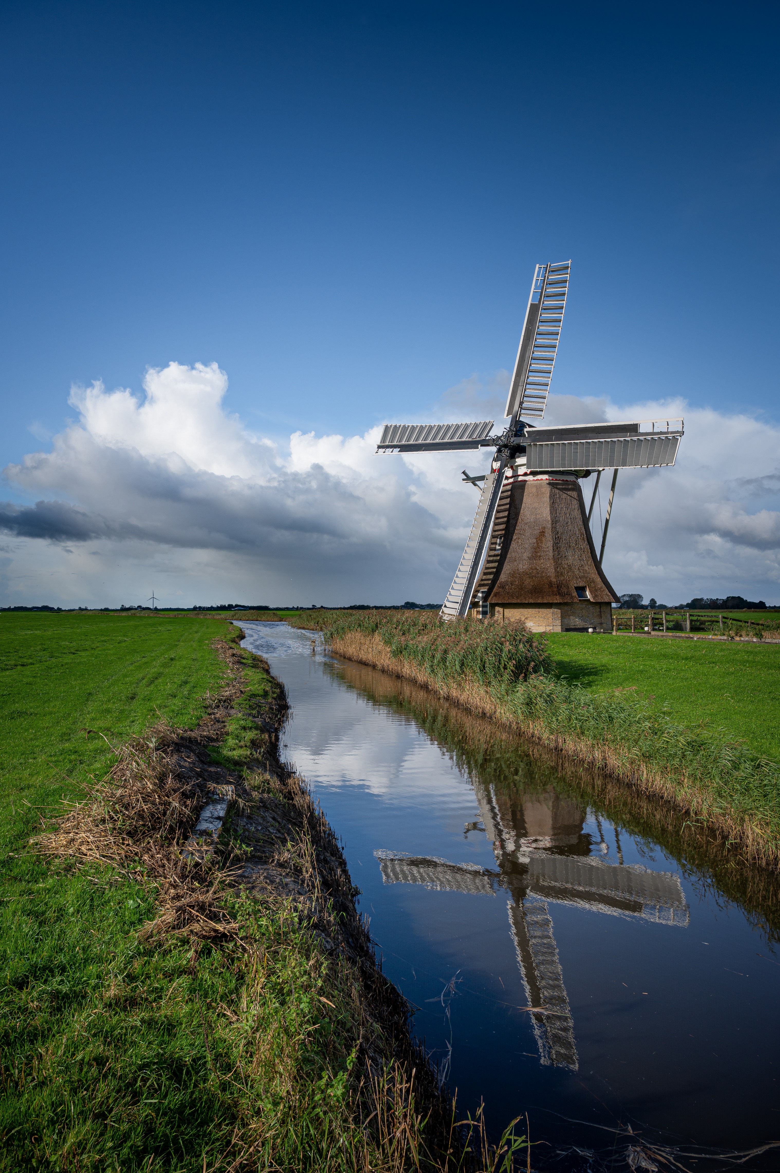 Windmill reflected in a canal in the Netherlands HD Phone Wallpaper