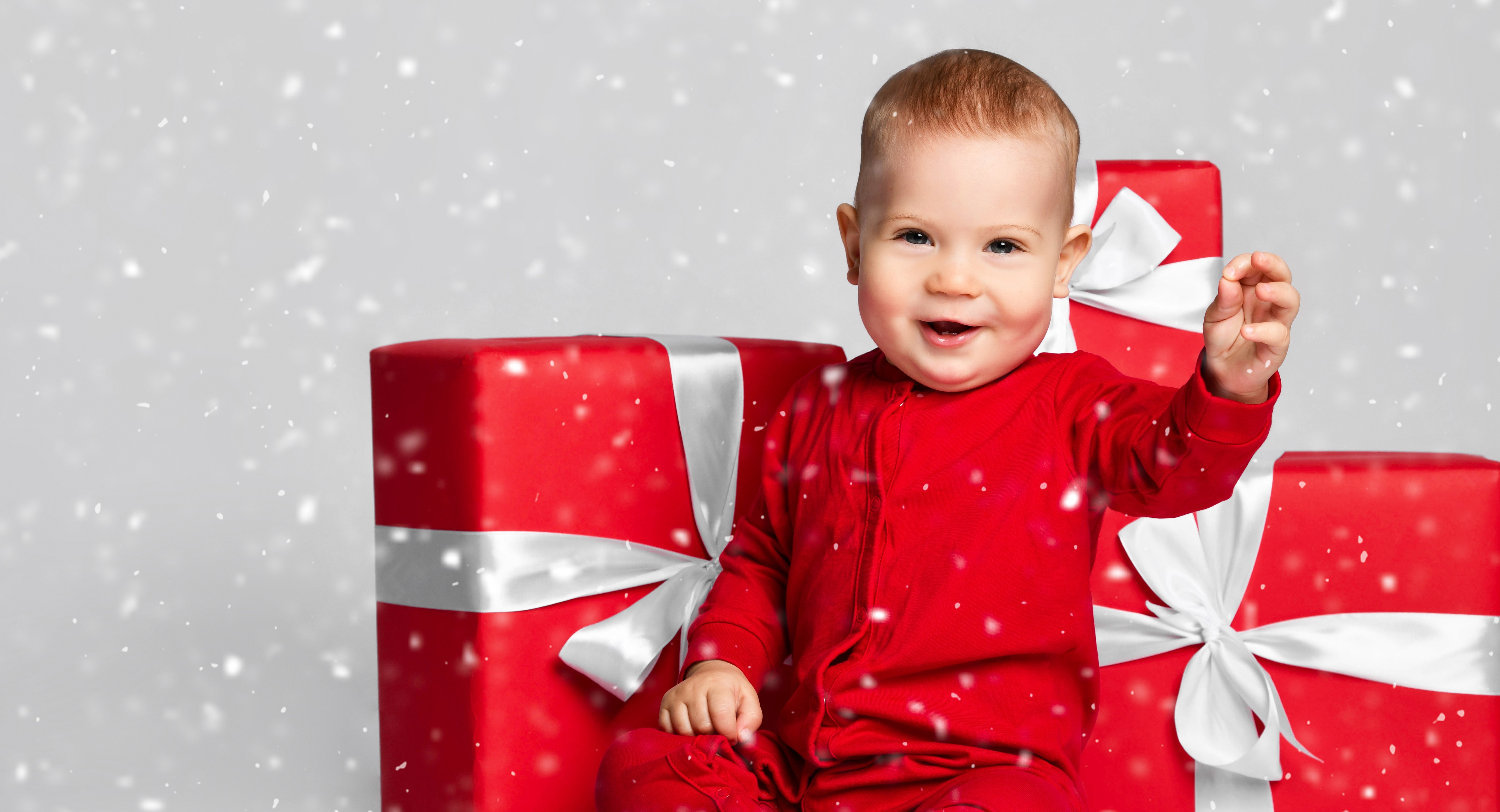 Baby in red pajamas with Christmas gifts HD Wallpaper