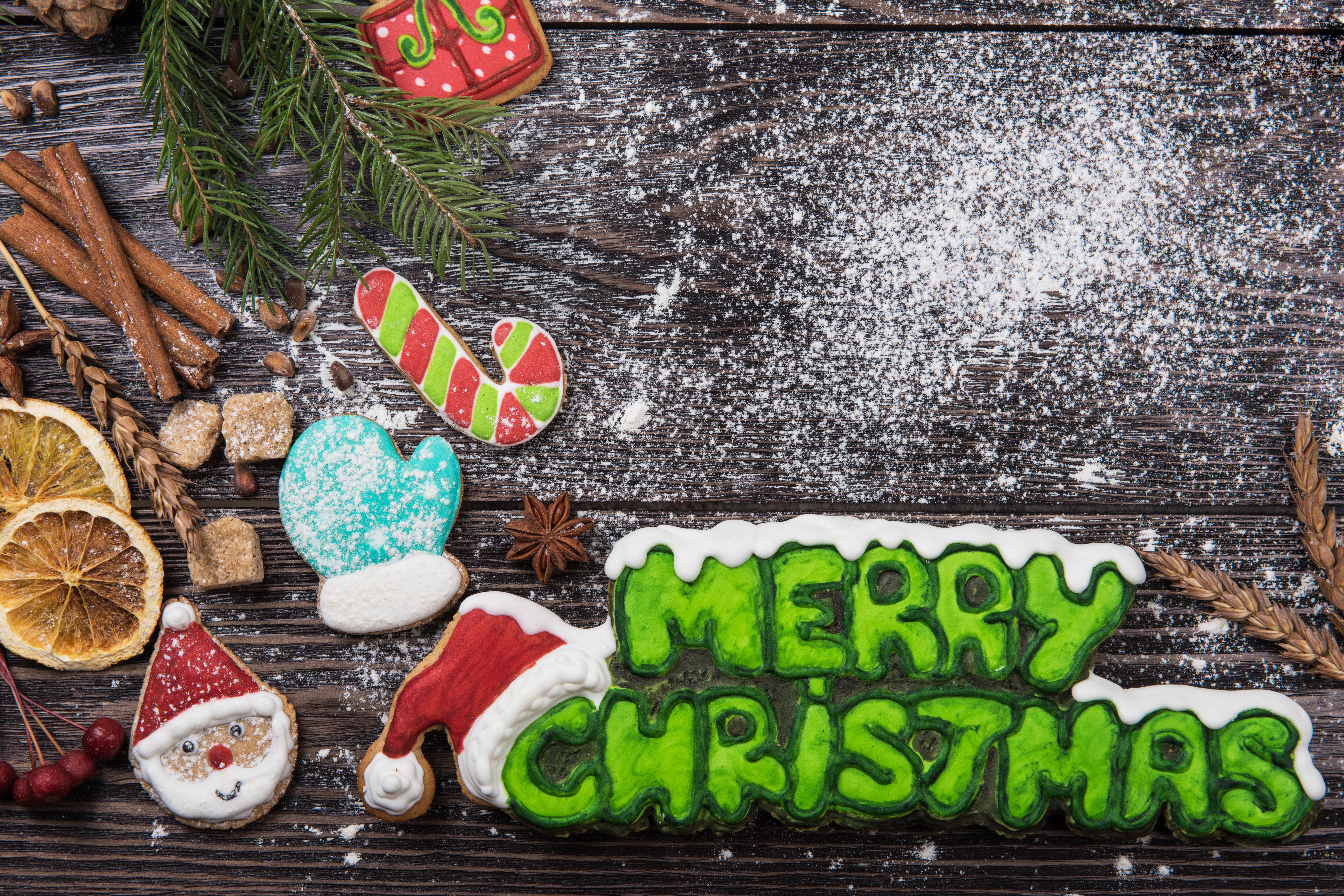 Christmas cookies with powdered sugar on wood HD Wallpaper