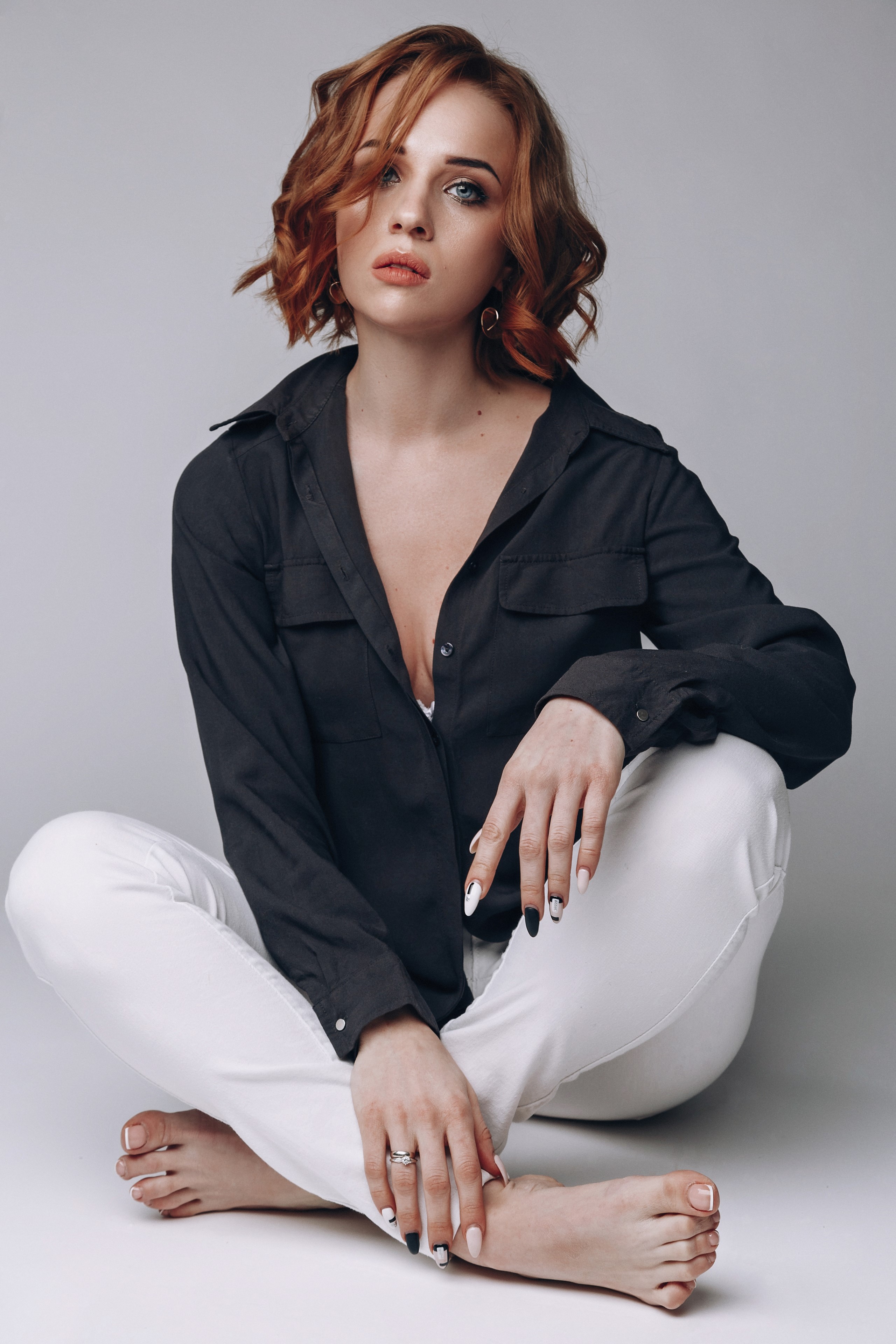 Redhead woman in black shirt and white pants HD Phone Wallpaper