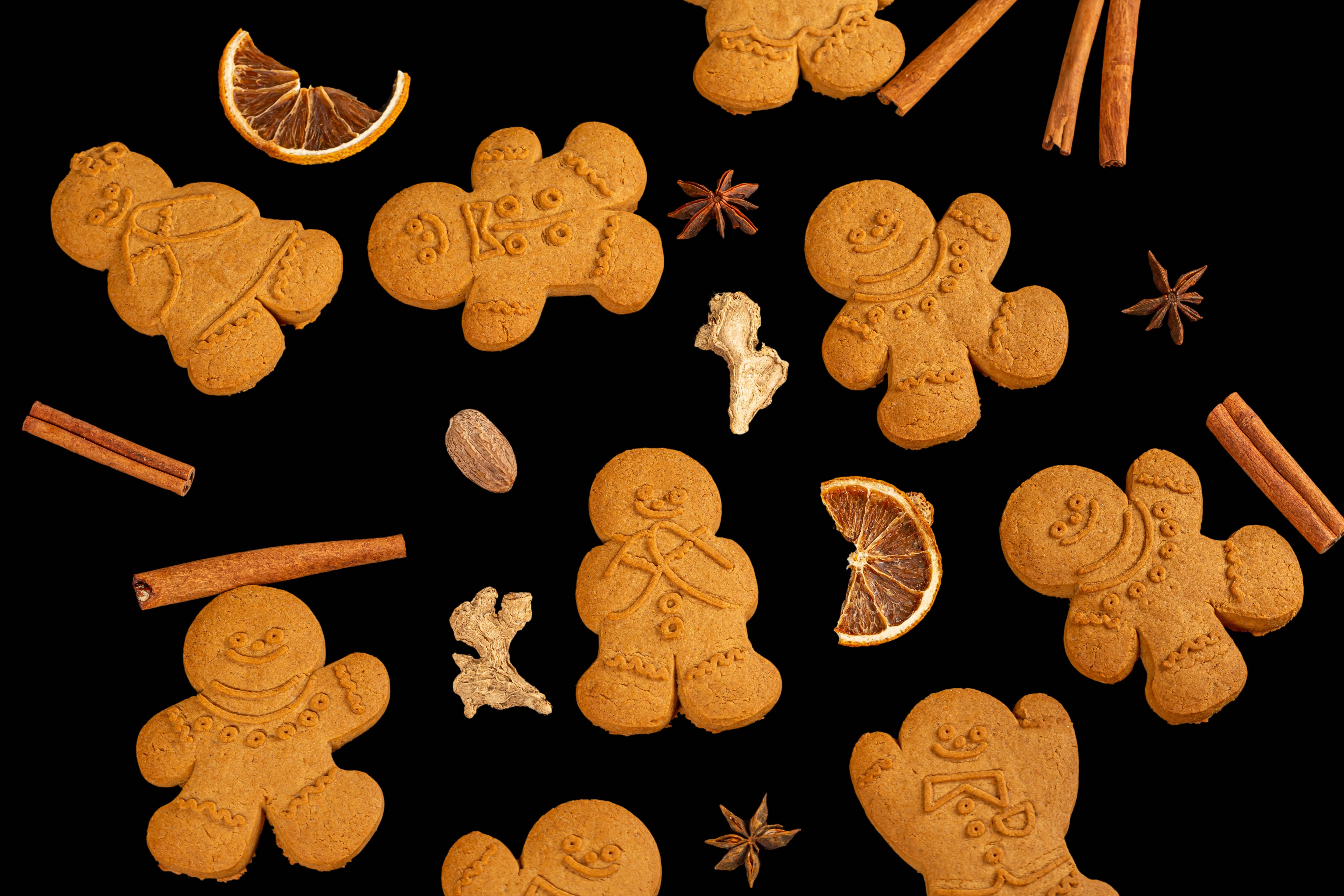 Christmas gingerbread cookies with spices and dried orange slices HD Wallpaper