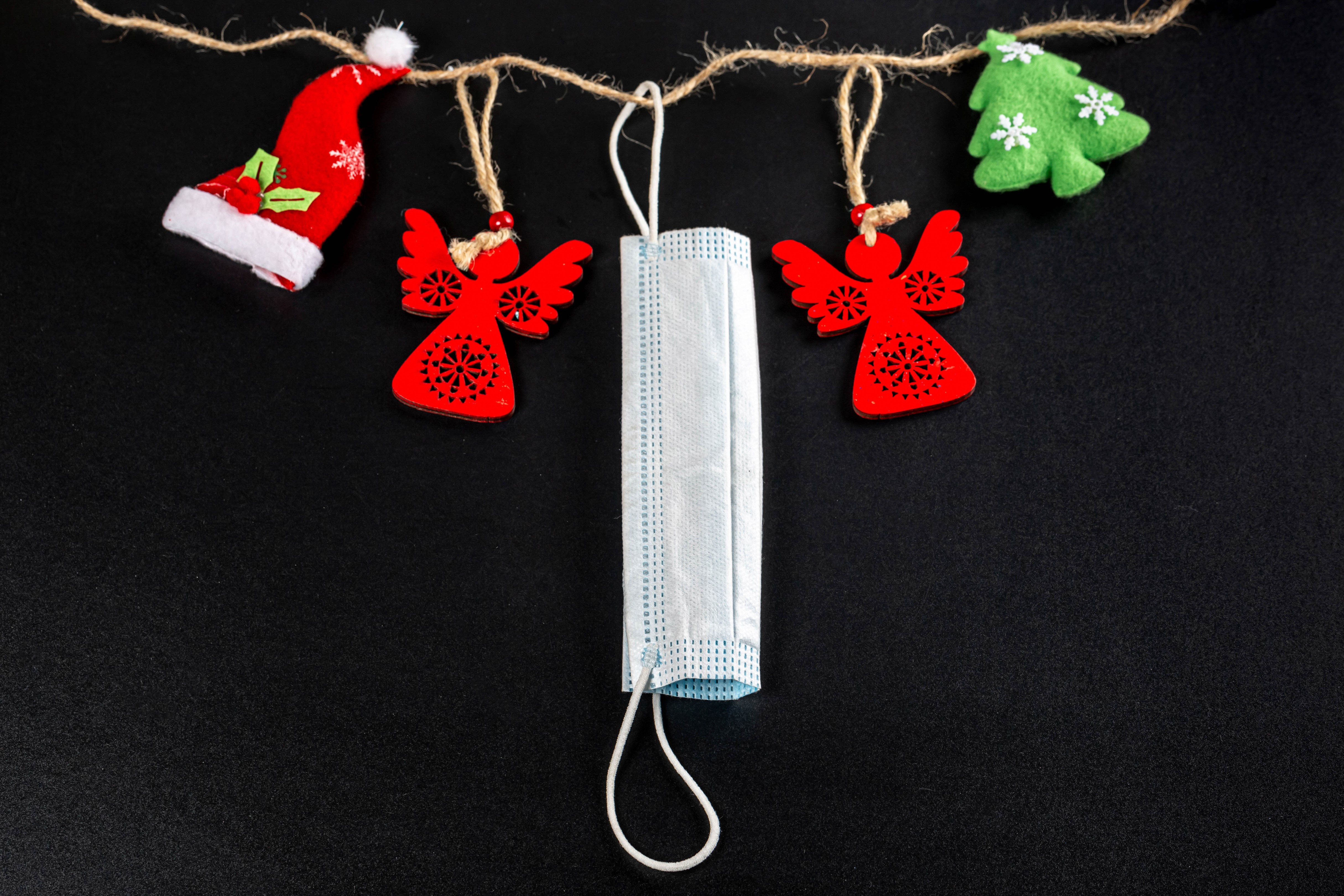Christmas decorations and face mask on string HD Wallpaper