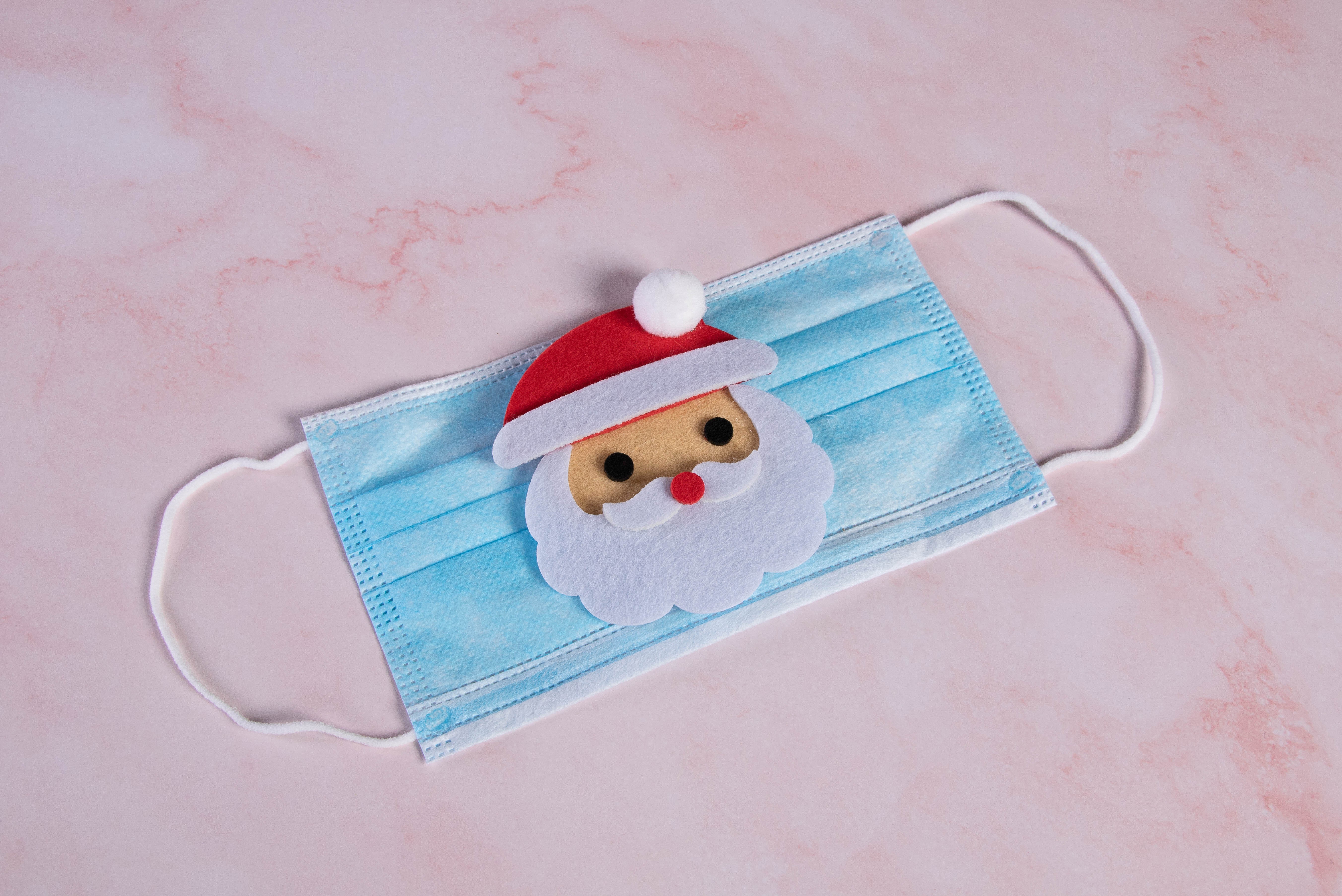 Santa Claus mask on pink marble background HD Wallpaper