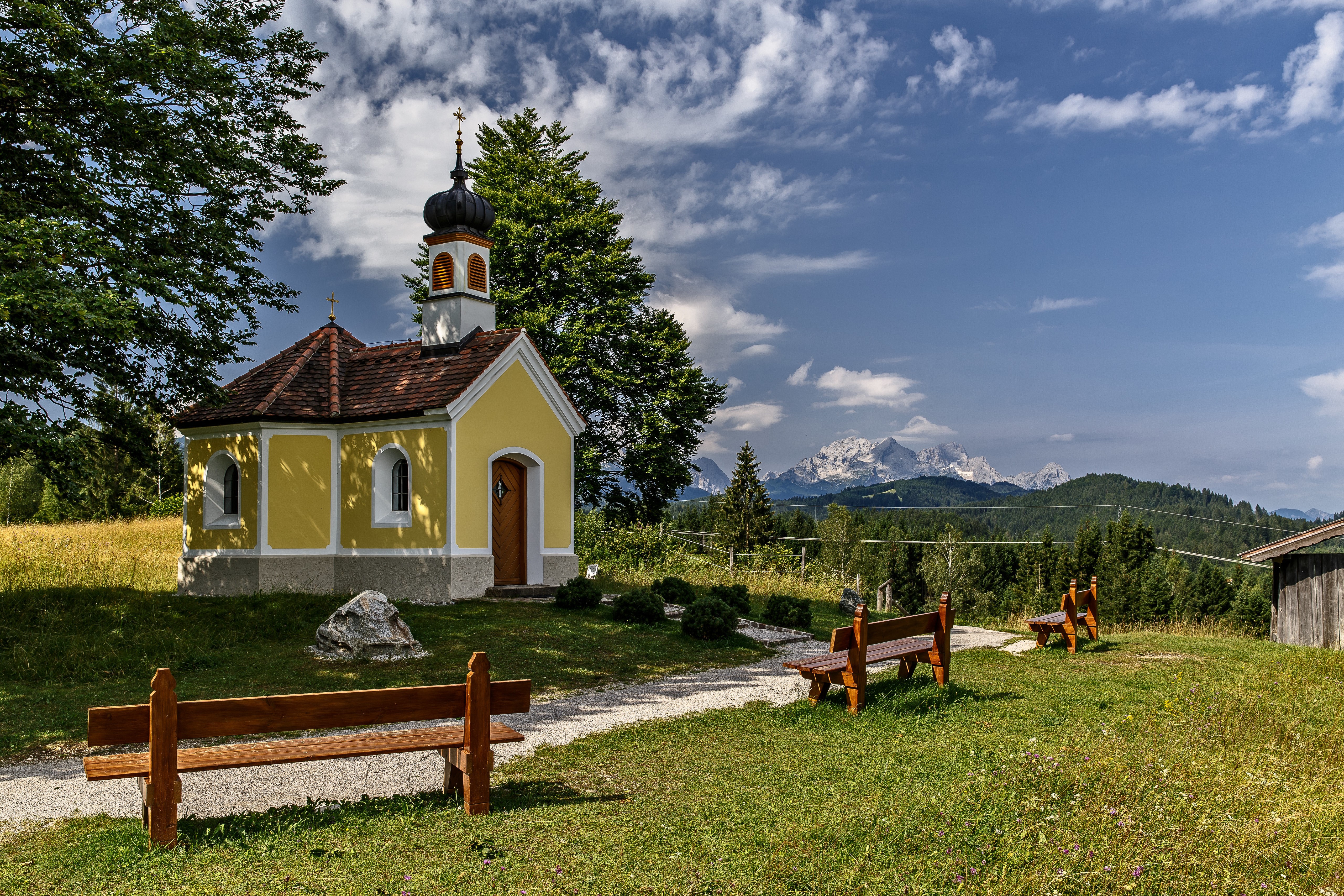 Yellow chapel in Bavaria with Alps mountains in background HD Wallpaper