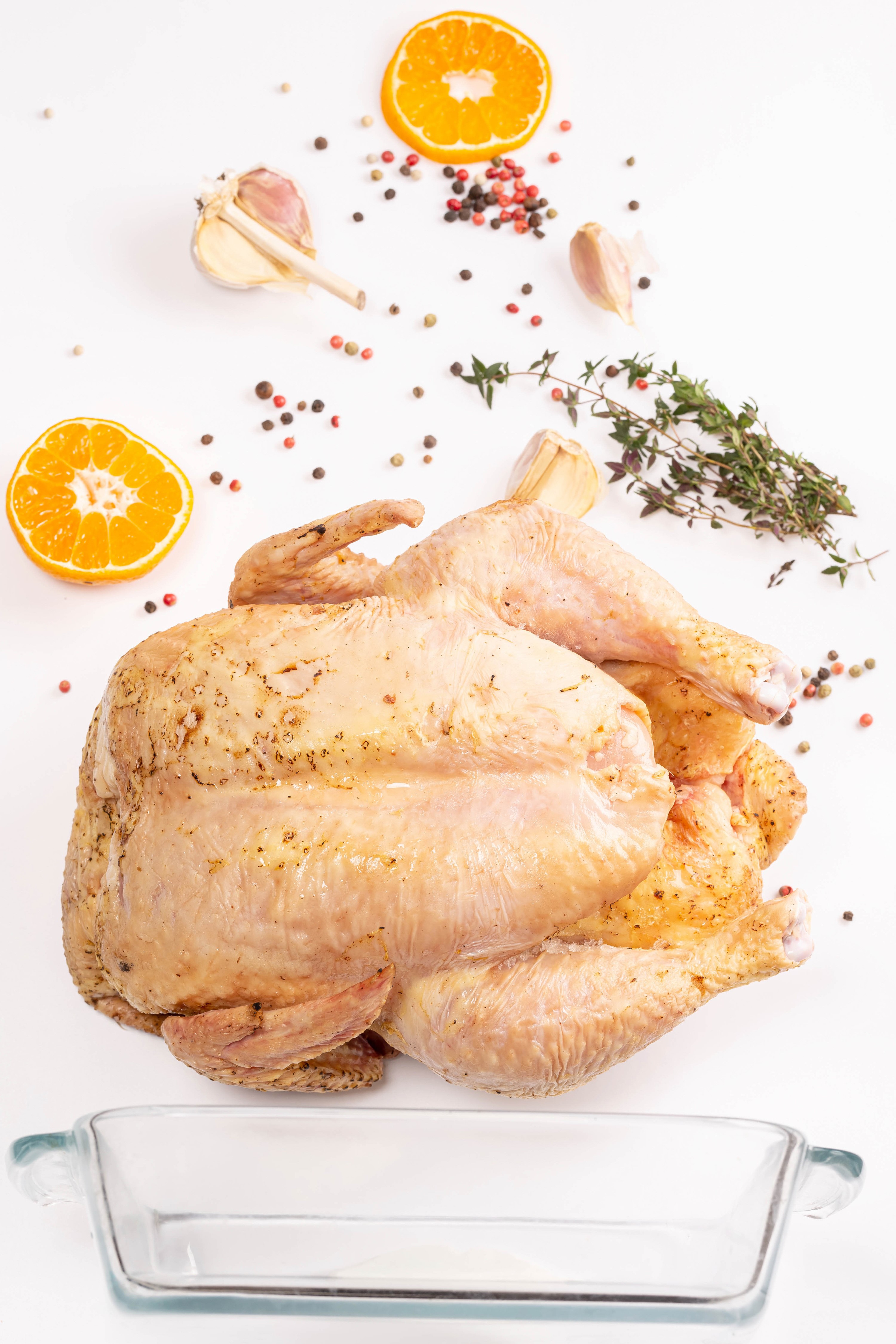 Raw seasoned chicken with oranges, garlic, and peppercorns HD Phone Wallpaper