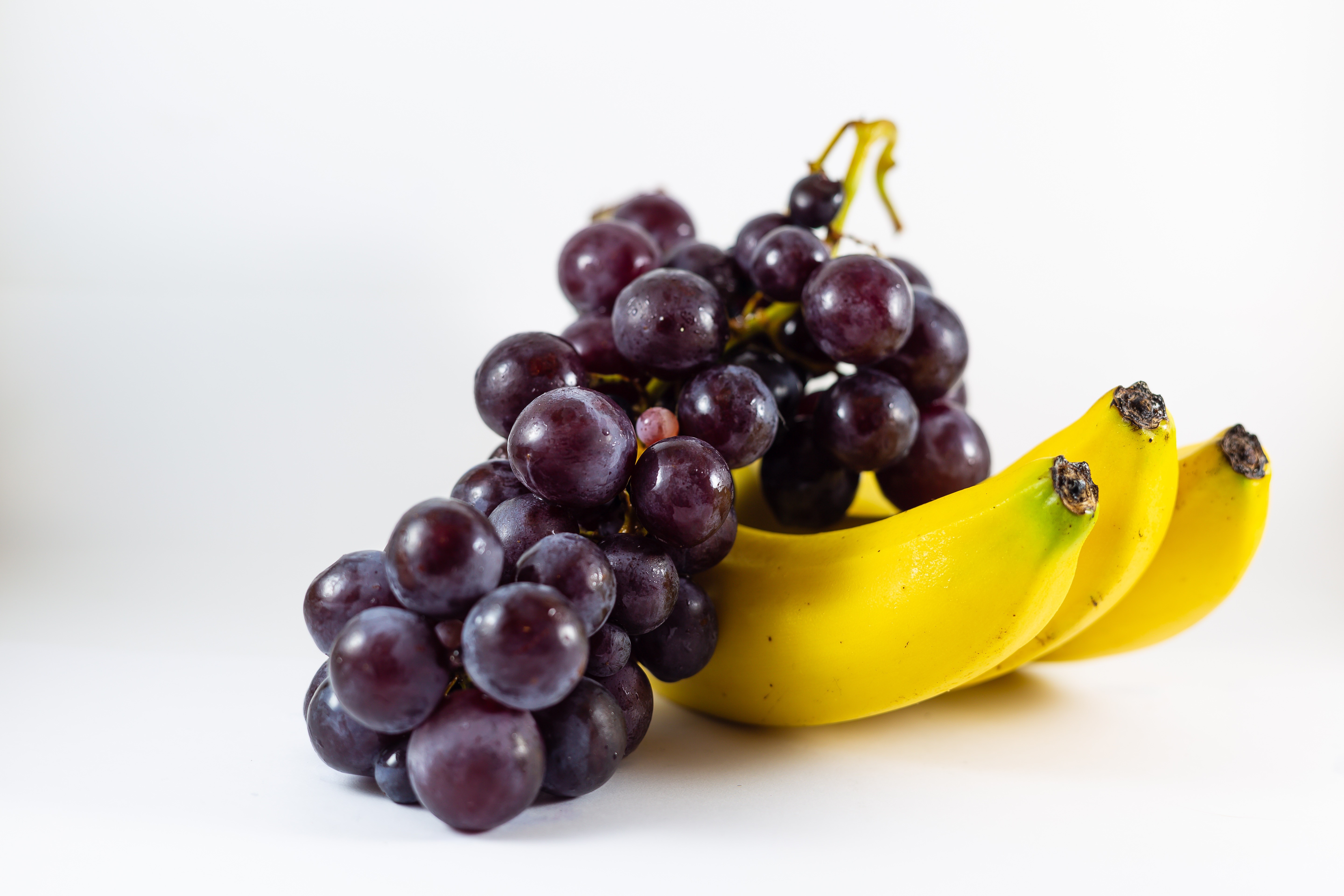 Grapes and Bananas on Gray Background HD Wallpaper