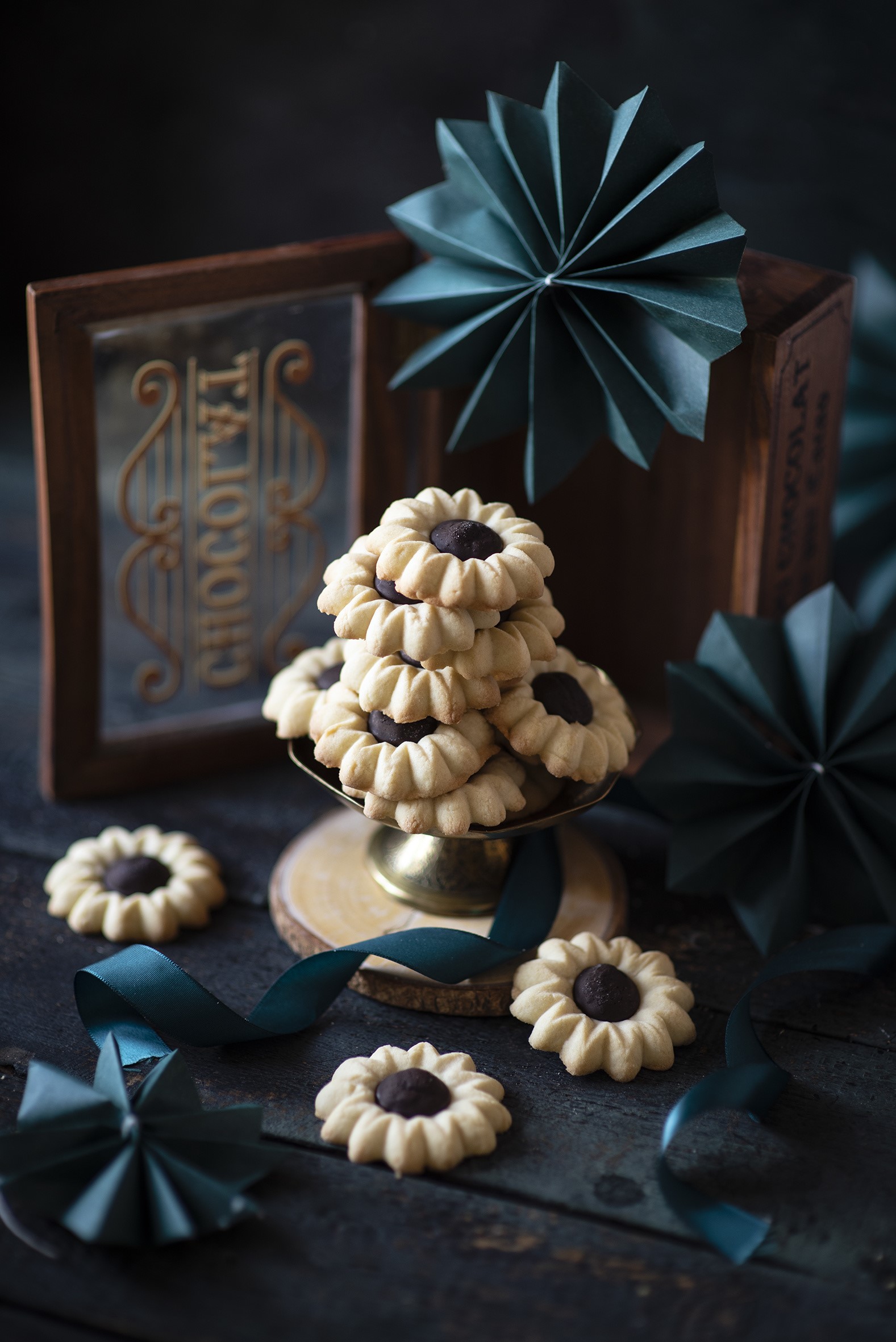 Flower-shaped cookies with chocolate filling on wooden table HD Phone Wallpaper
