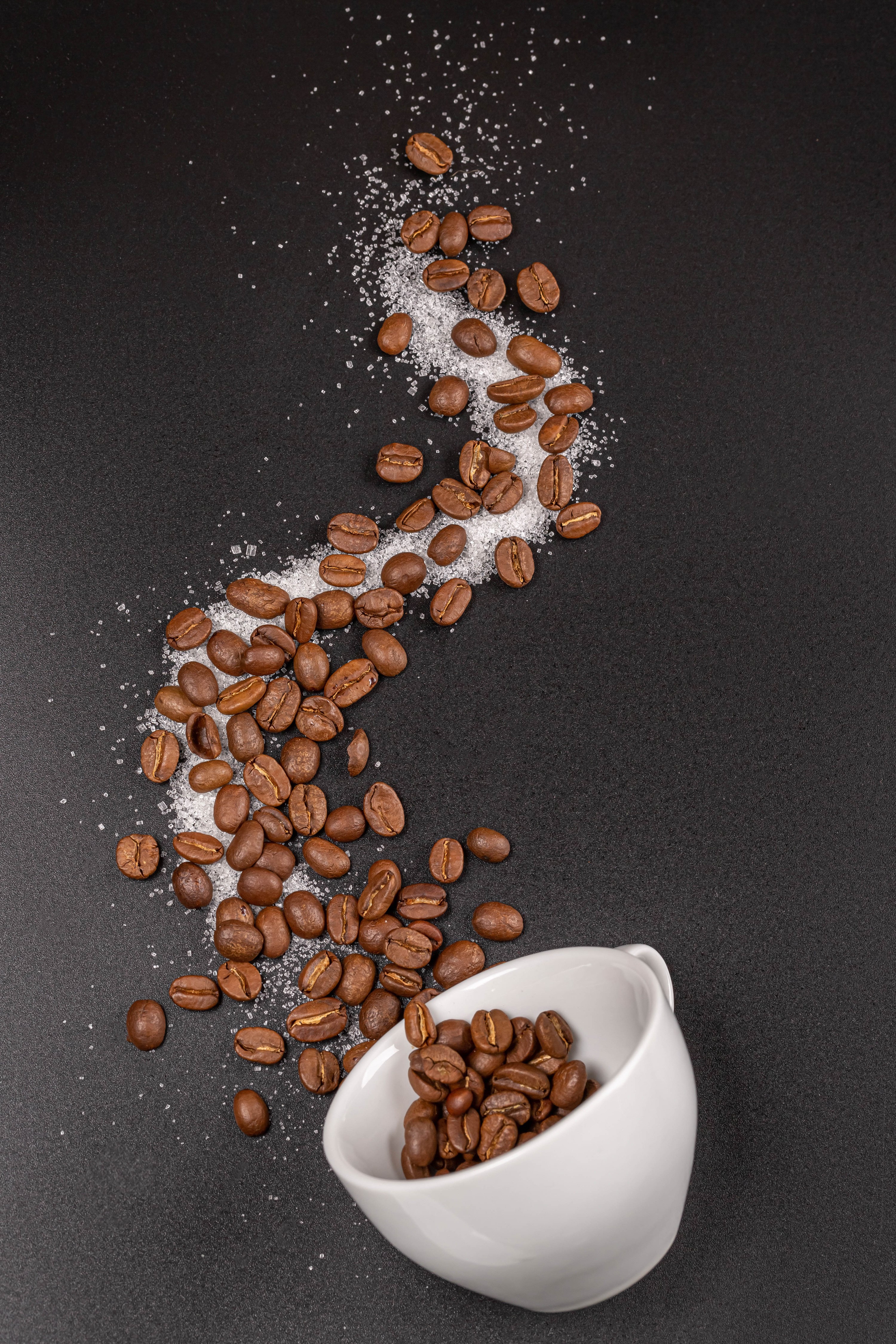 Coffee beans and sugar spilled from a cup HD Phone Wallpaper