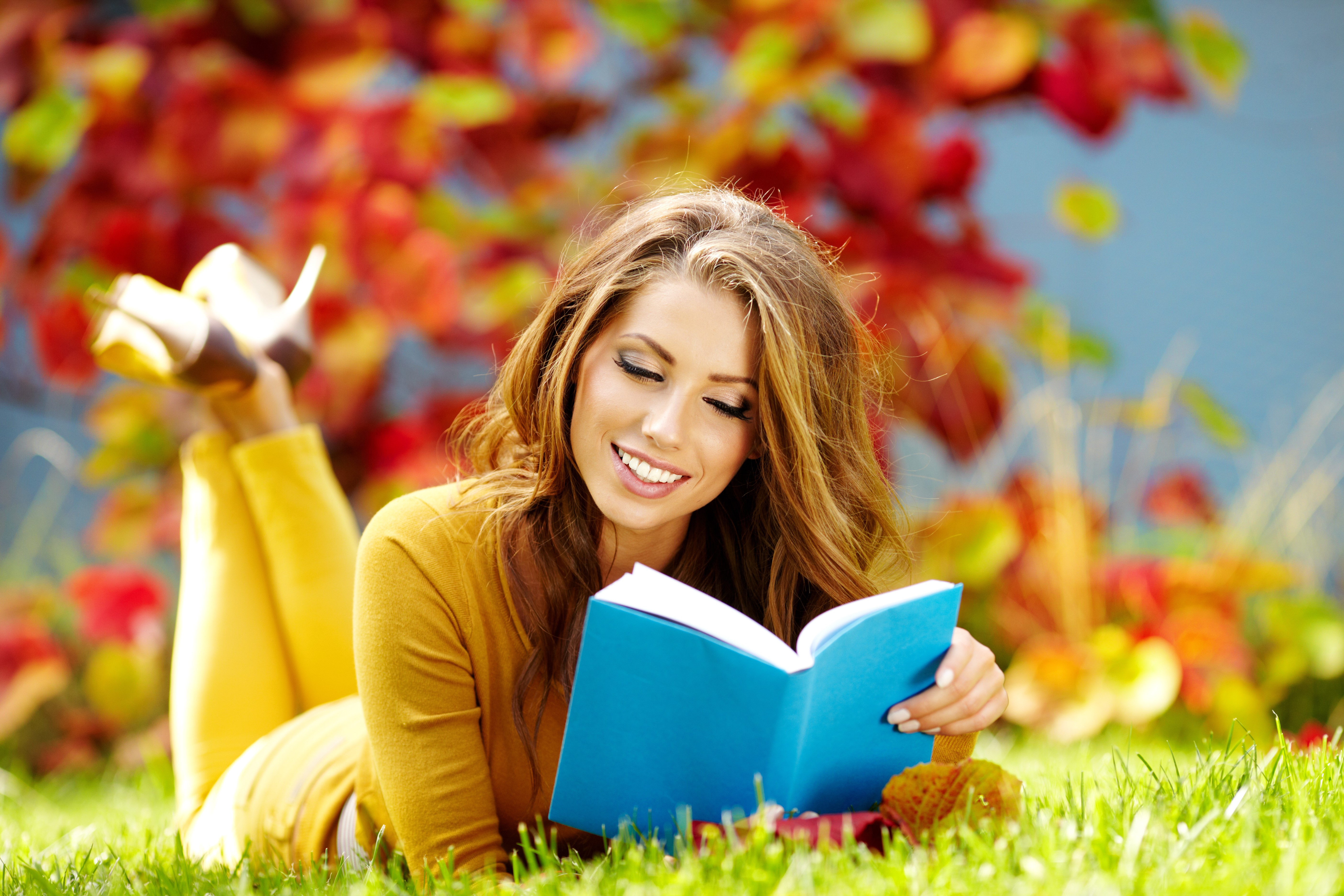 Woman reading a book in autumn HD Wallpaper