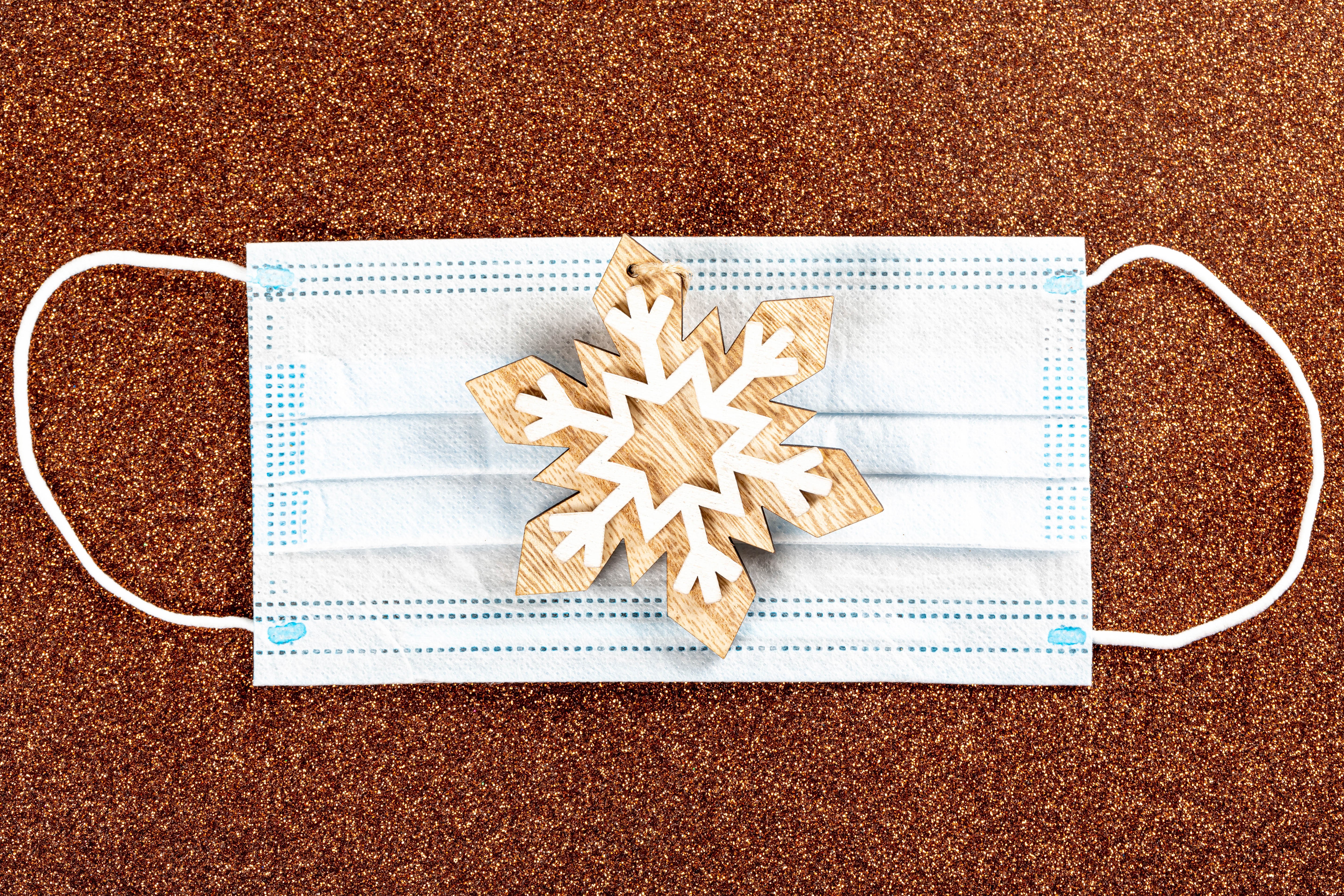 Christmas snowflake ornament on a face mask HD Wallpaper