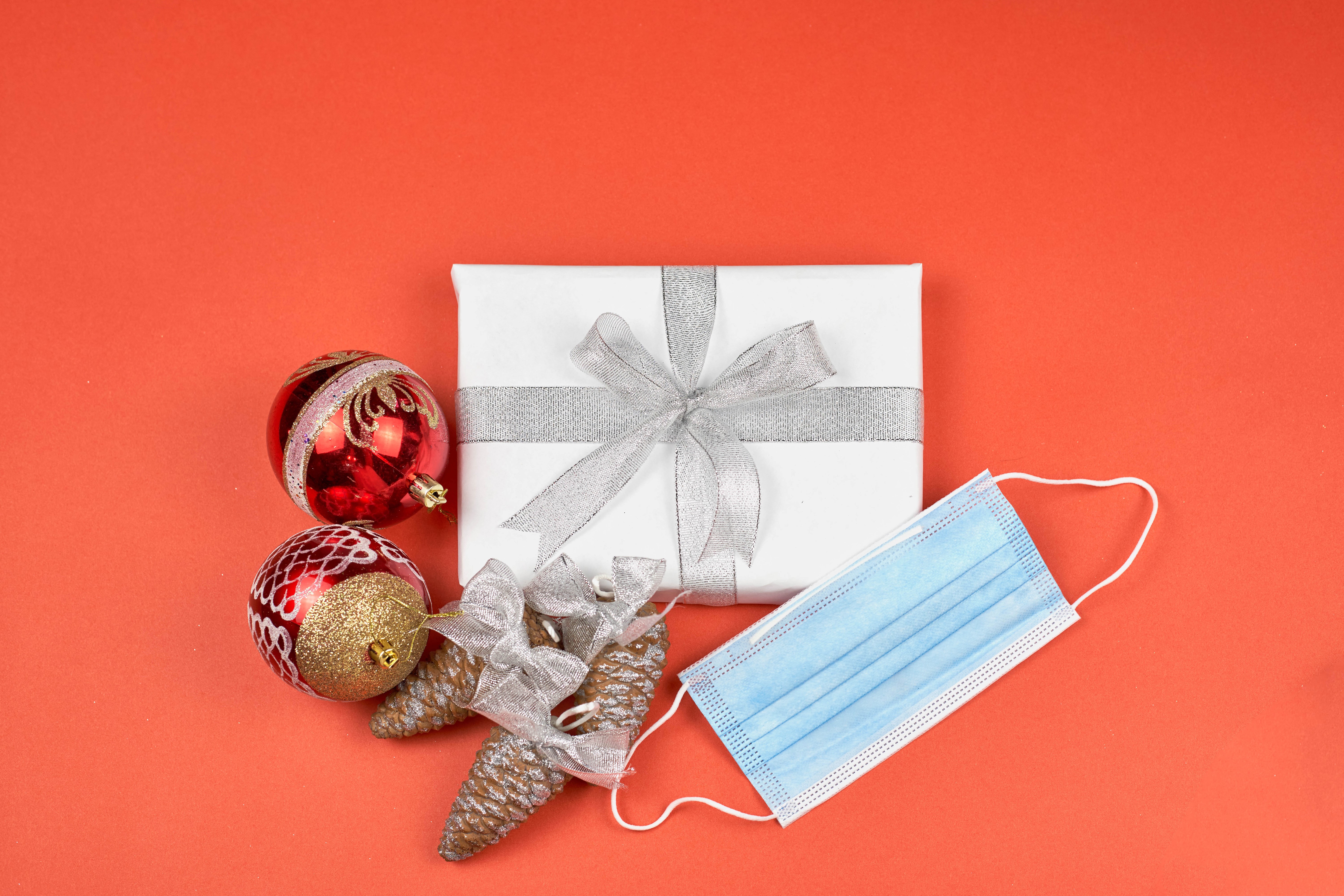 Christmas gift with ornaments and face mask HD Wallpaper