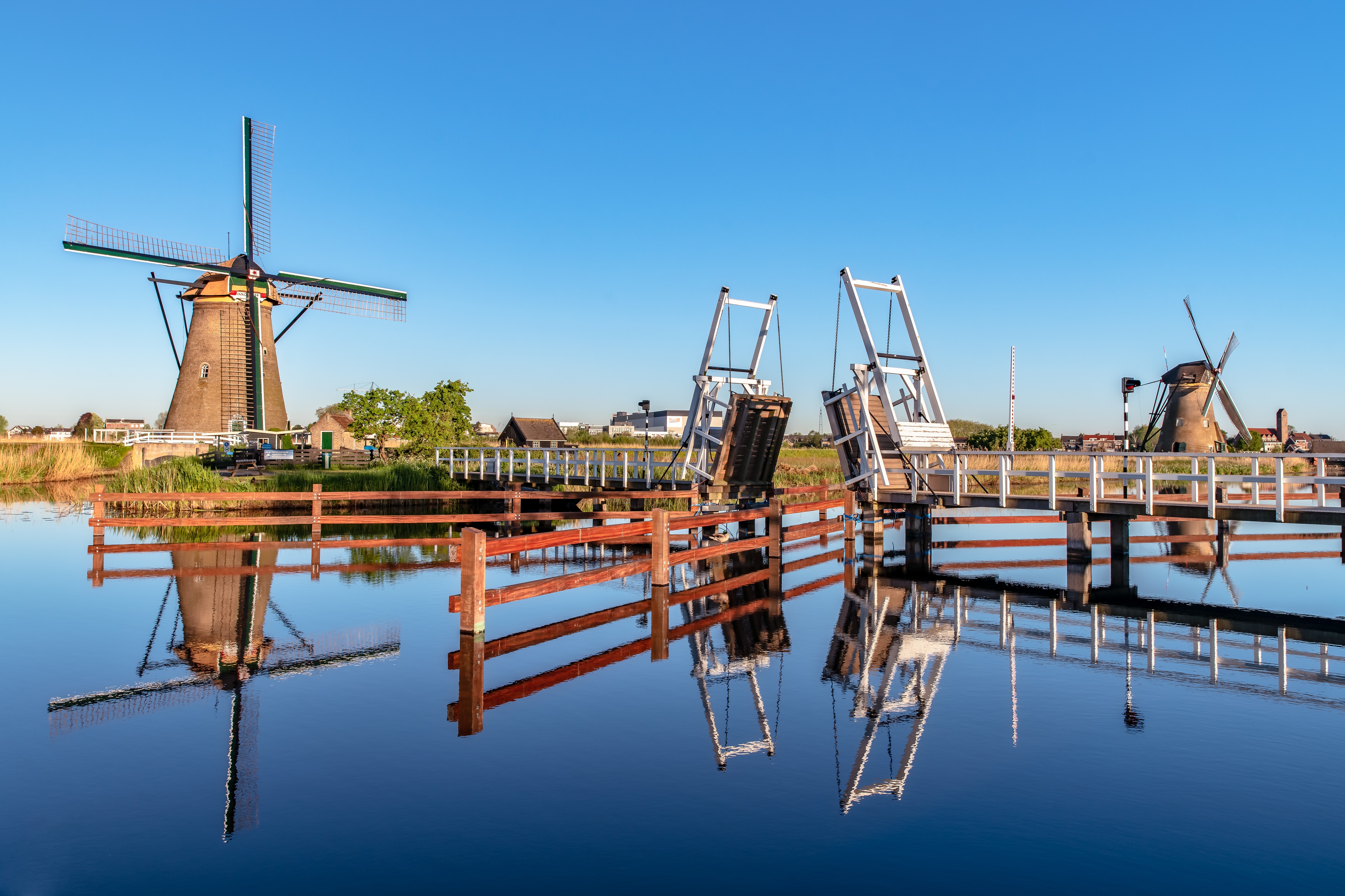Windmills and bridges over a canal in the Netherlands HD Wallpaper