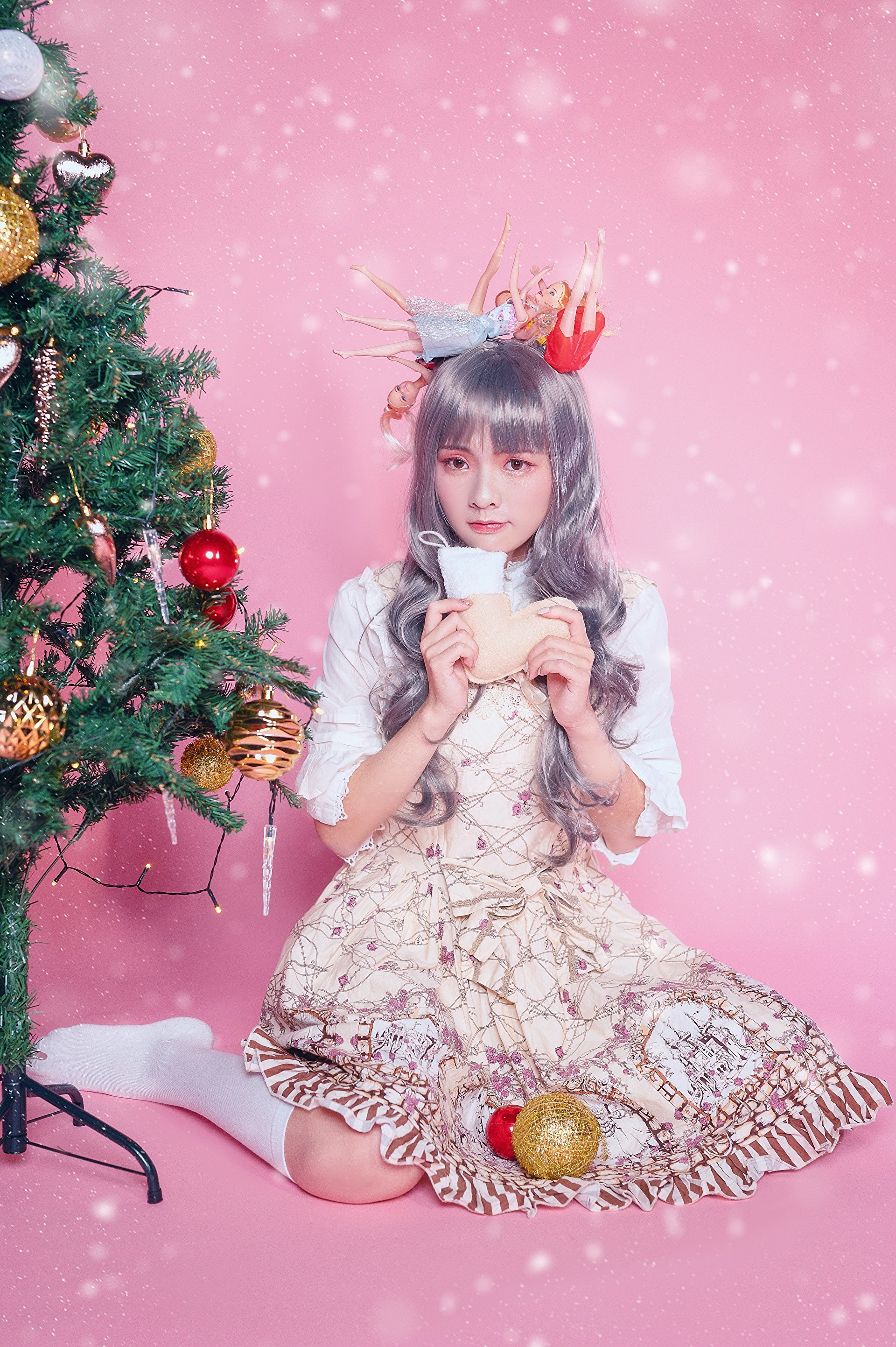 Asian girl in lolita dress with dolls on head by Christmas tree HD Phone Wallpaper