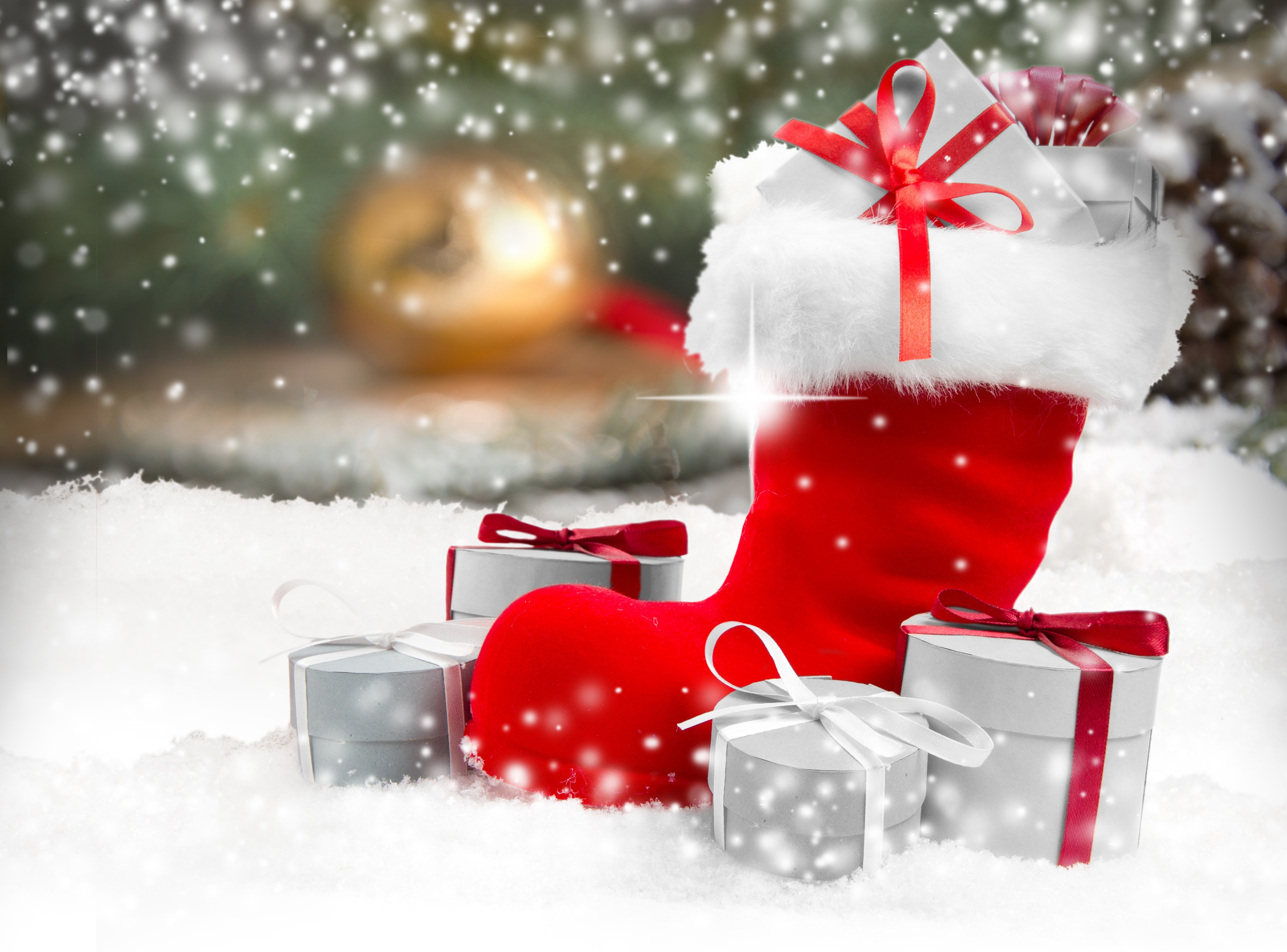 Christmas stocking with gifts in snow HD Wallpaper