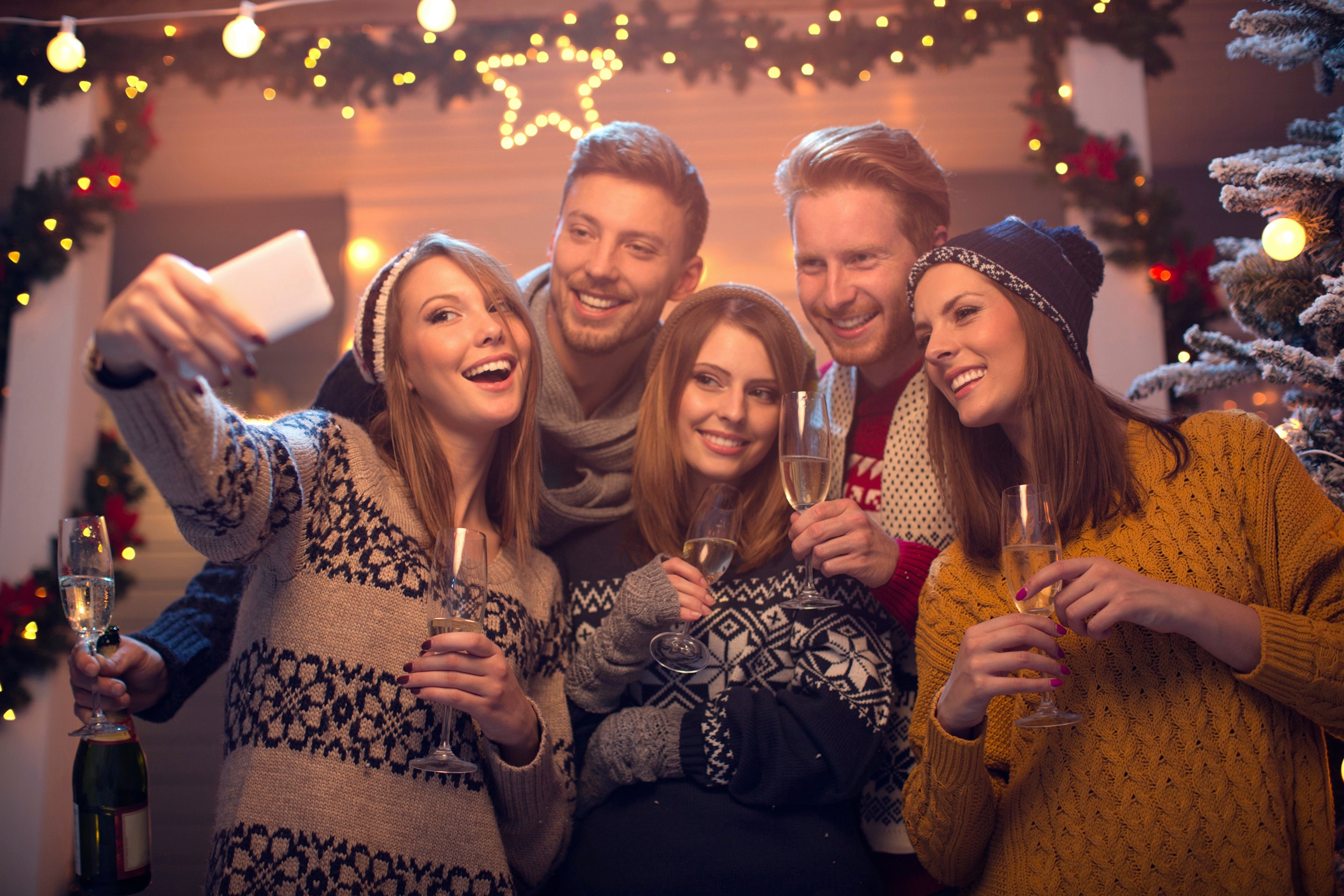 Friends taking a selfie during Christmas HD Wallpaper