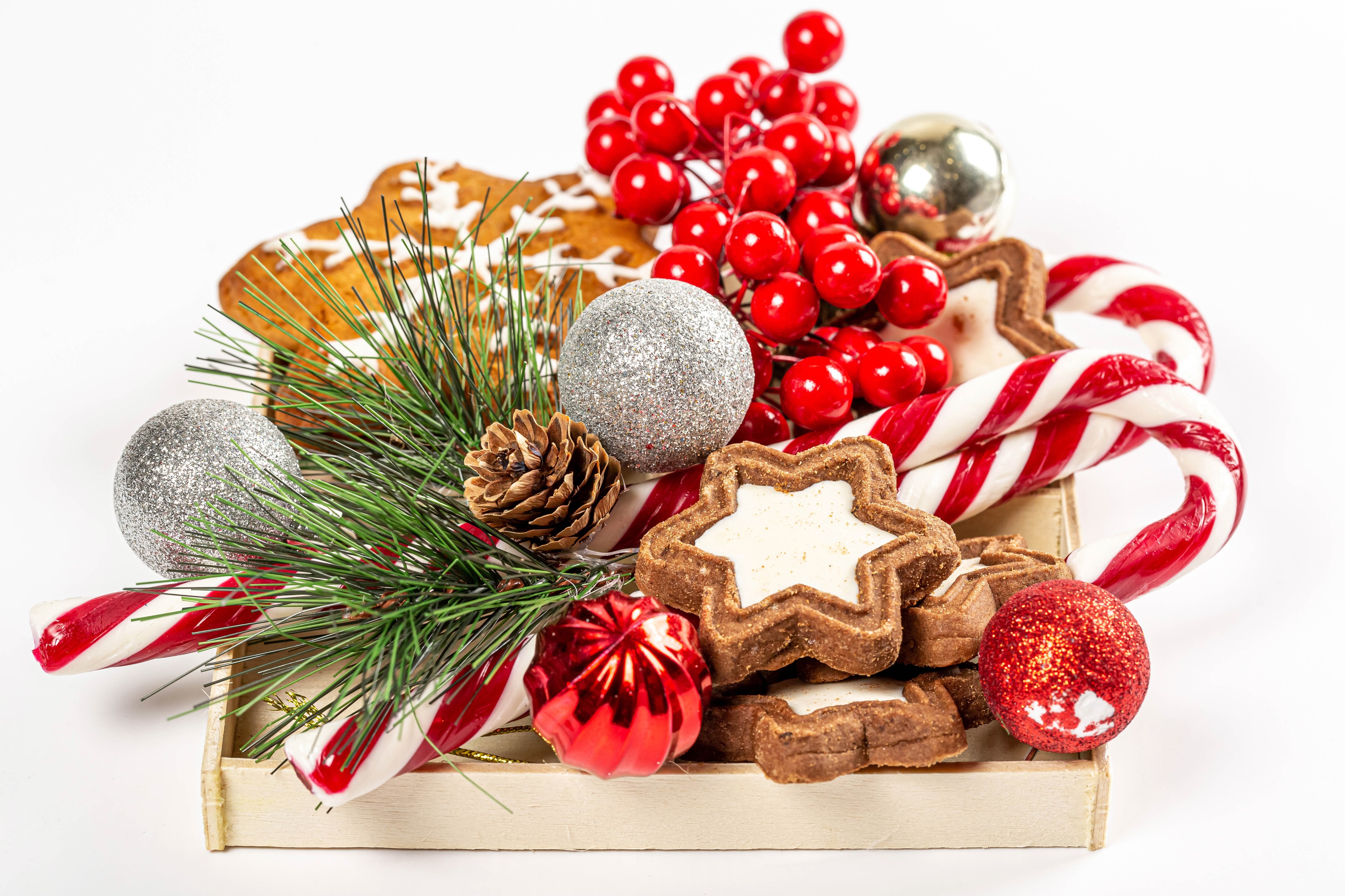 Christmas cookies, candy canes, and ornaments on a tray HD Wallpaper