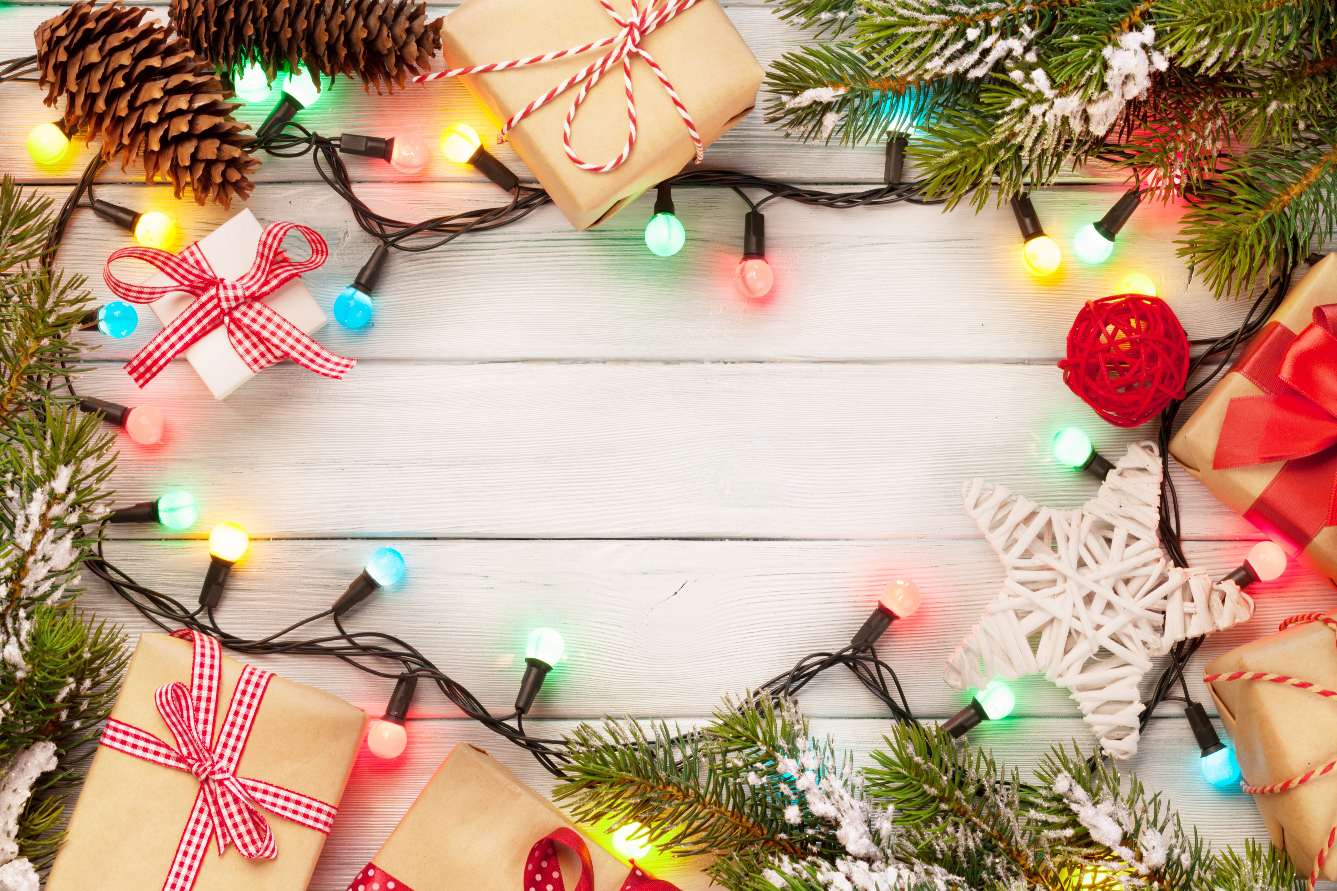 Christmas Gifts and Lights on Wooden Table HD Wallpaper