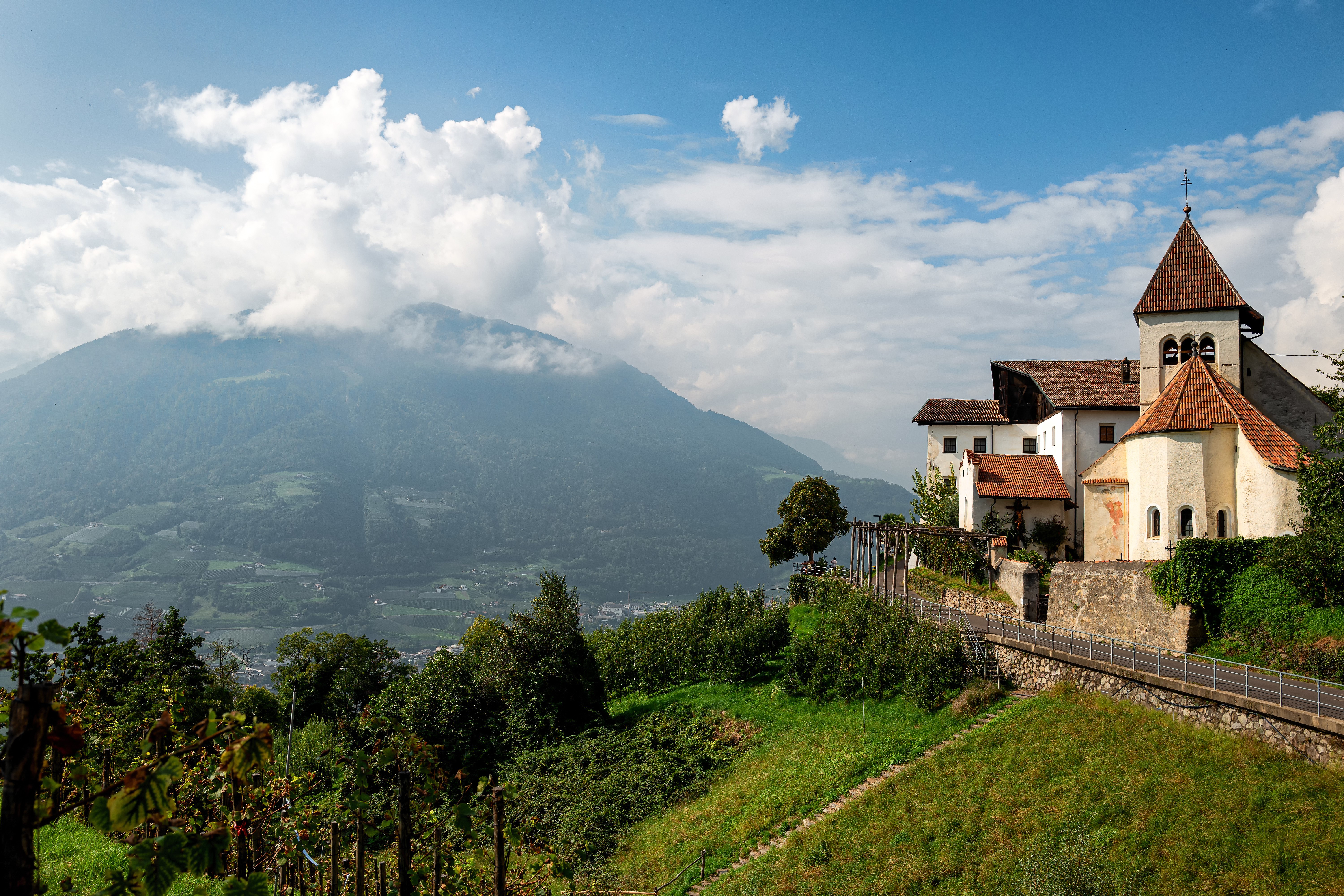Church in Dorf Tirol, Italy, with Alps and Clouds HD Wallpaper
