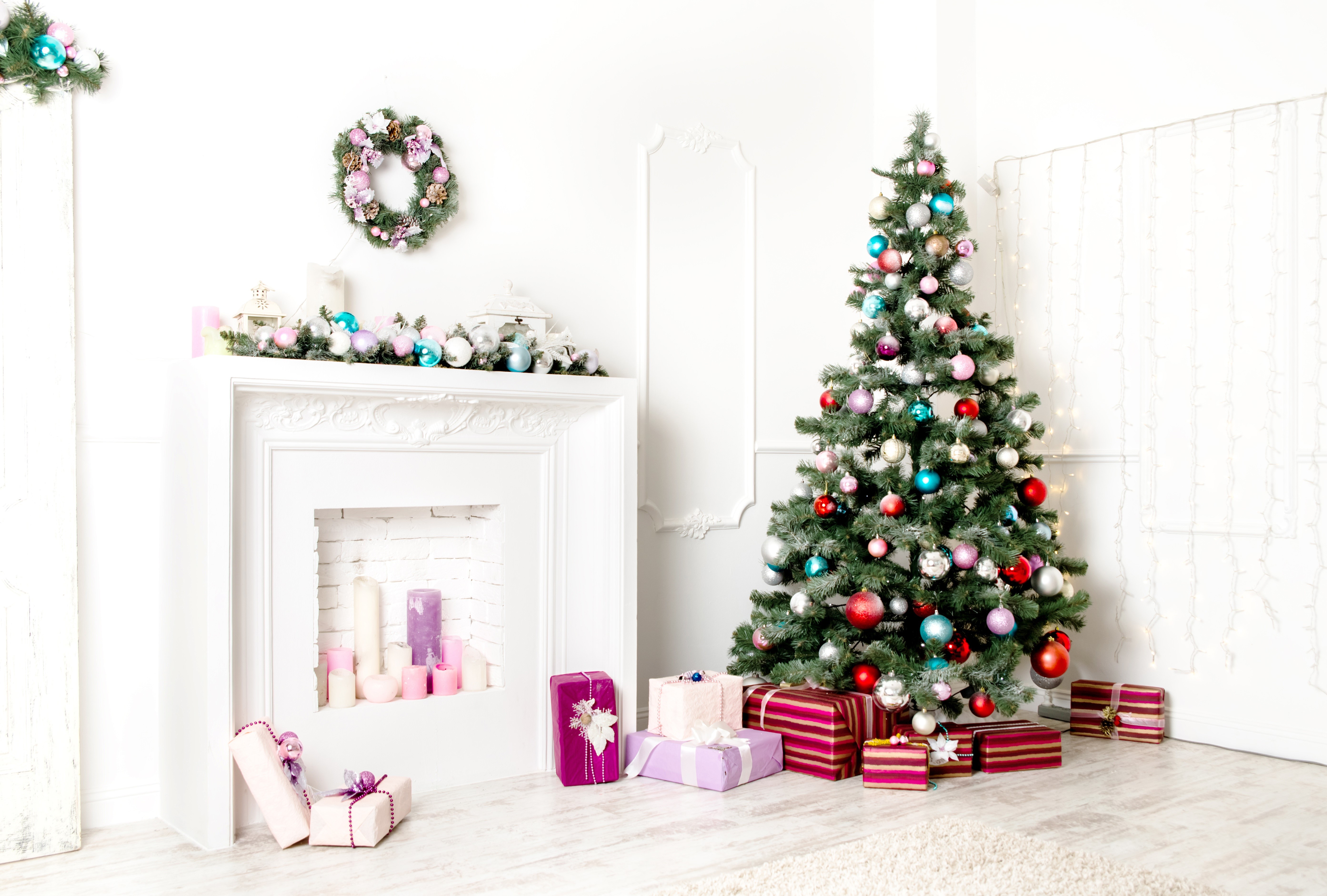 Christmas tree with ornaments and gifts by fireplace HD Wallpaper