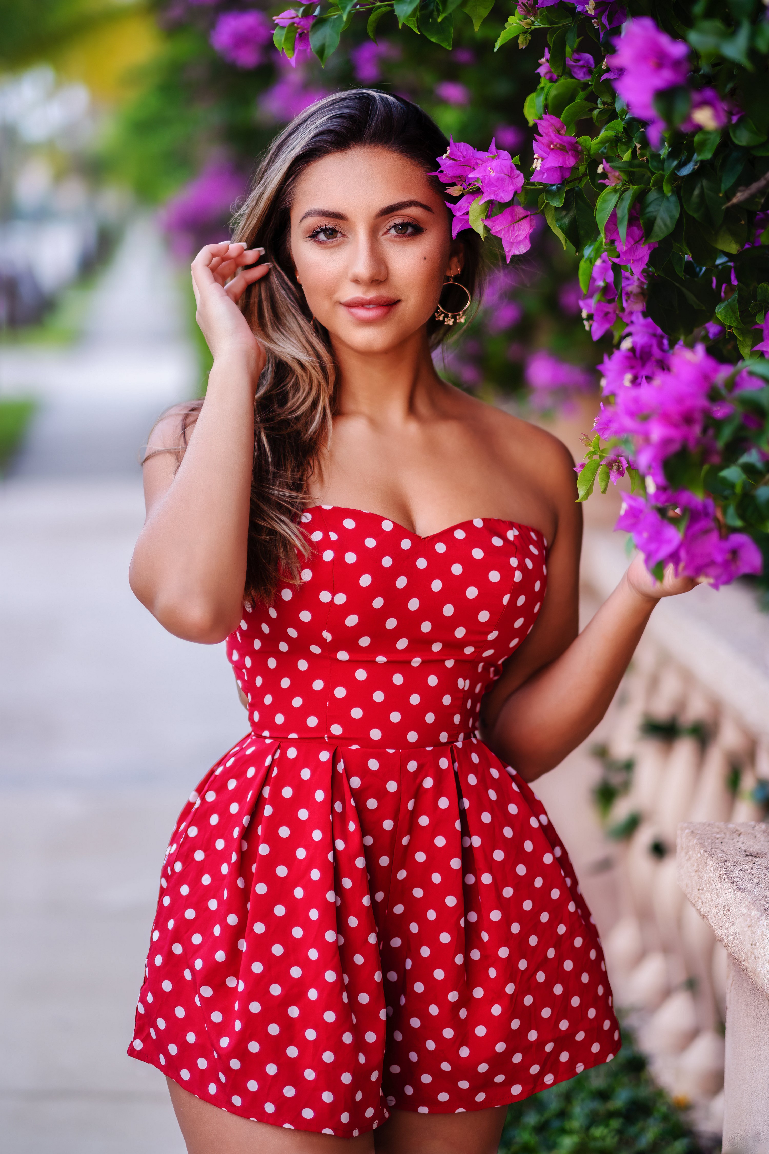 Woman in red polka dot dress with purple flowers HD Phone Wallpaper