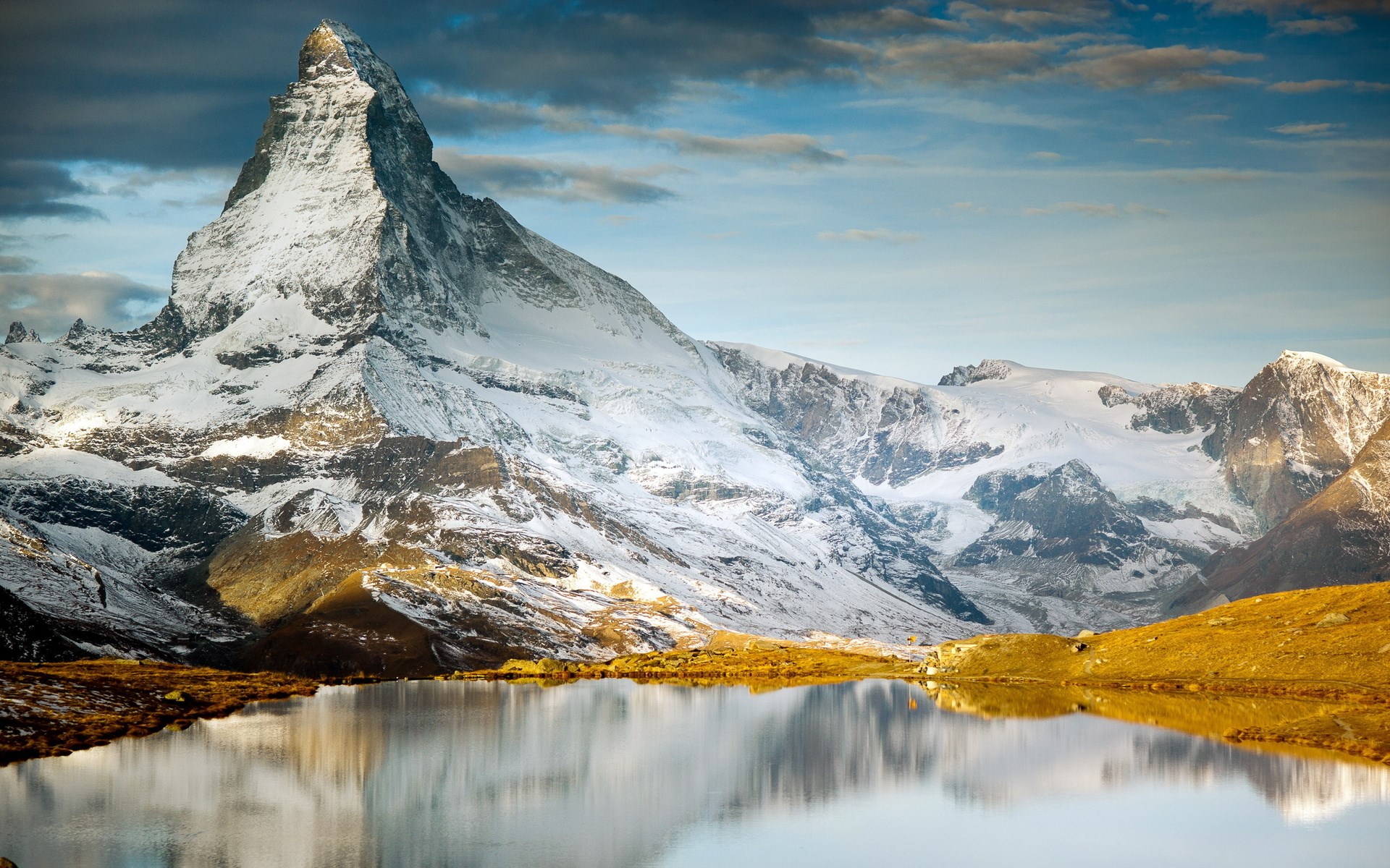 Matterhorn mountain reflected in a lake HD Wallpaper