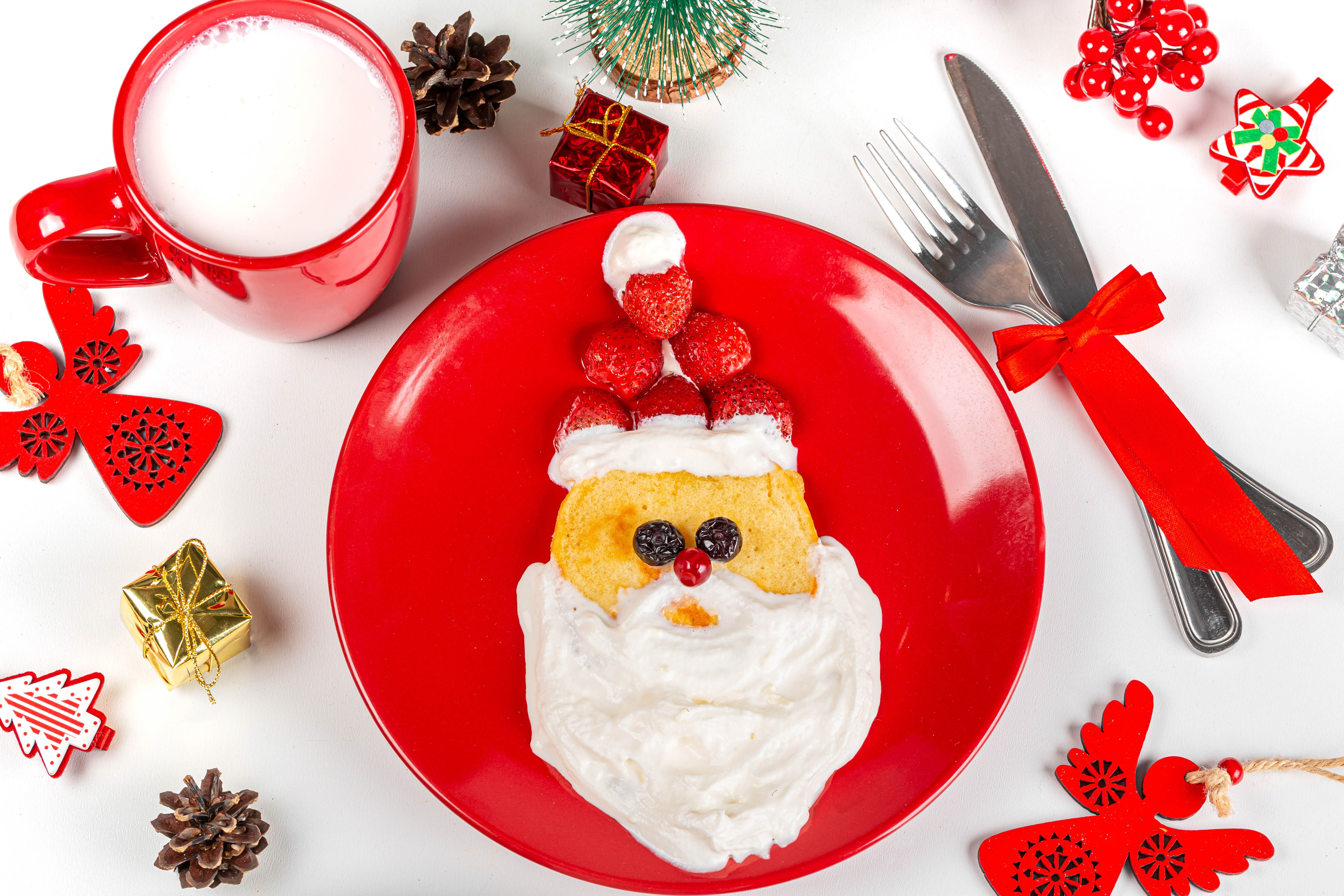 Santa Claus pancake with milk and Christmas decorations HD Wallpaper