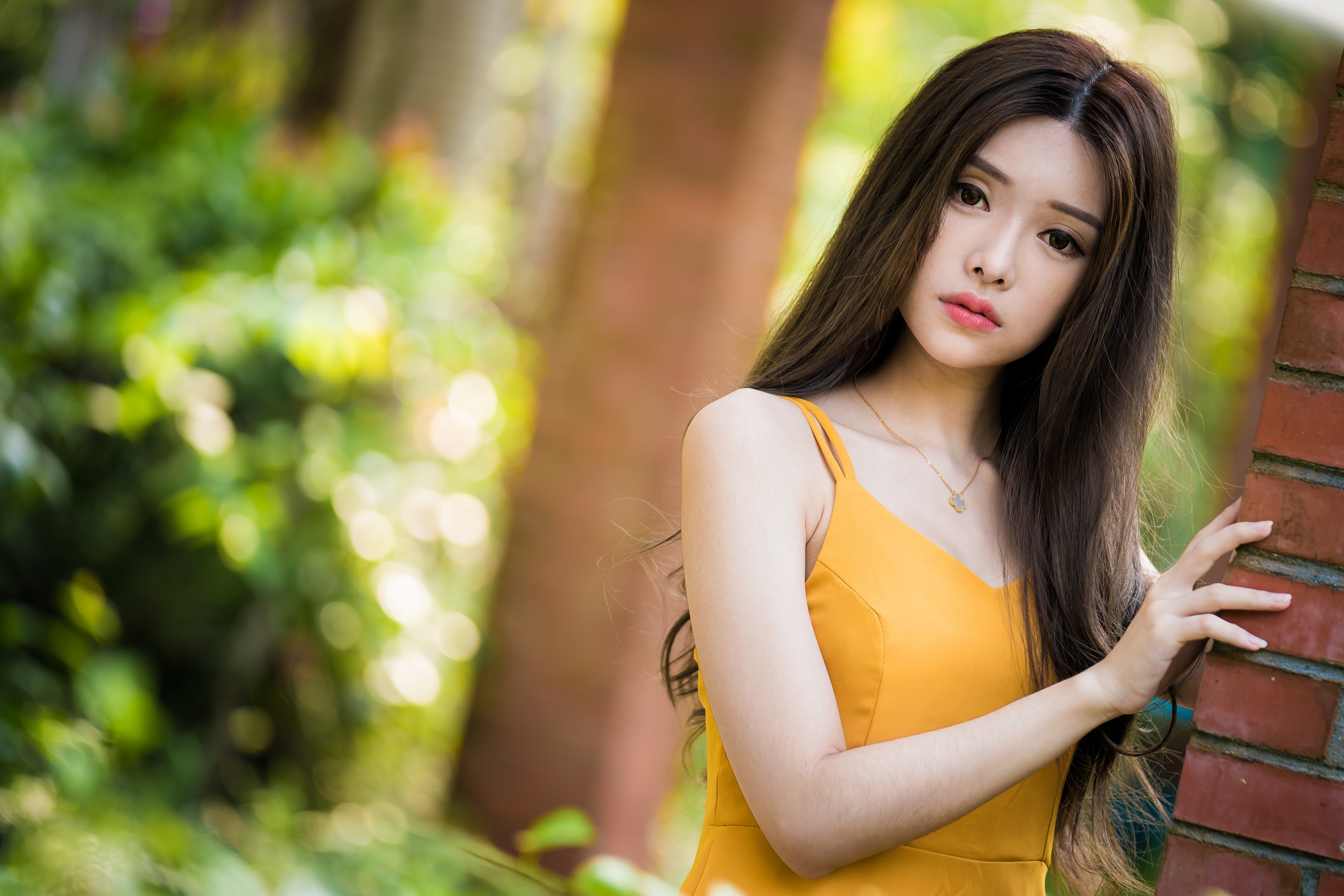 Asian woman in yellow dress with bokeh background HD Wallpaper