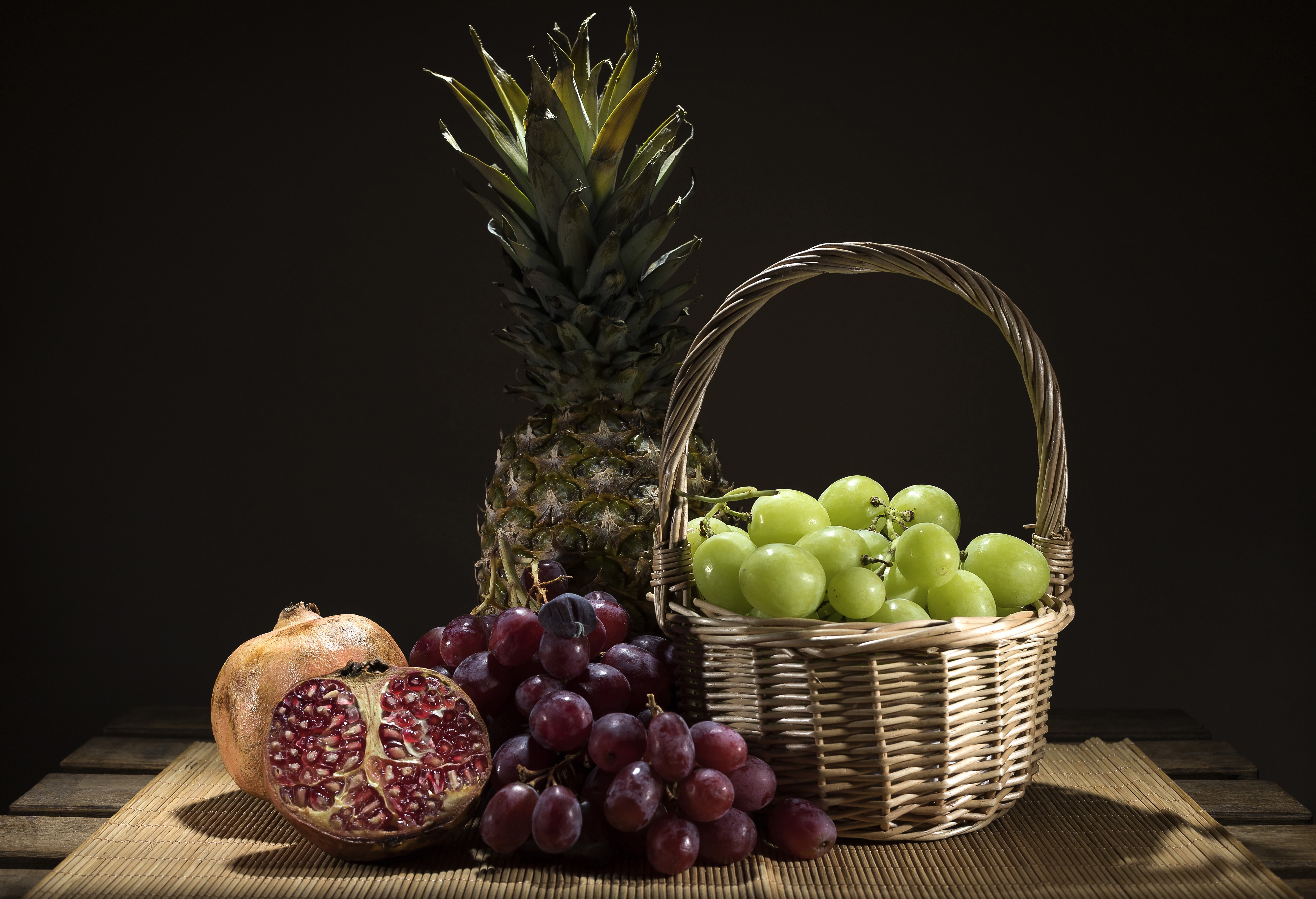 Grapes, Pomegranate, and Pineapple in Wicker Basket HD Wallpaper