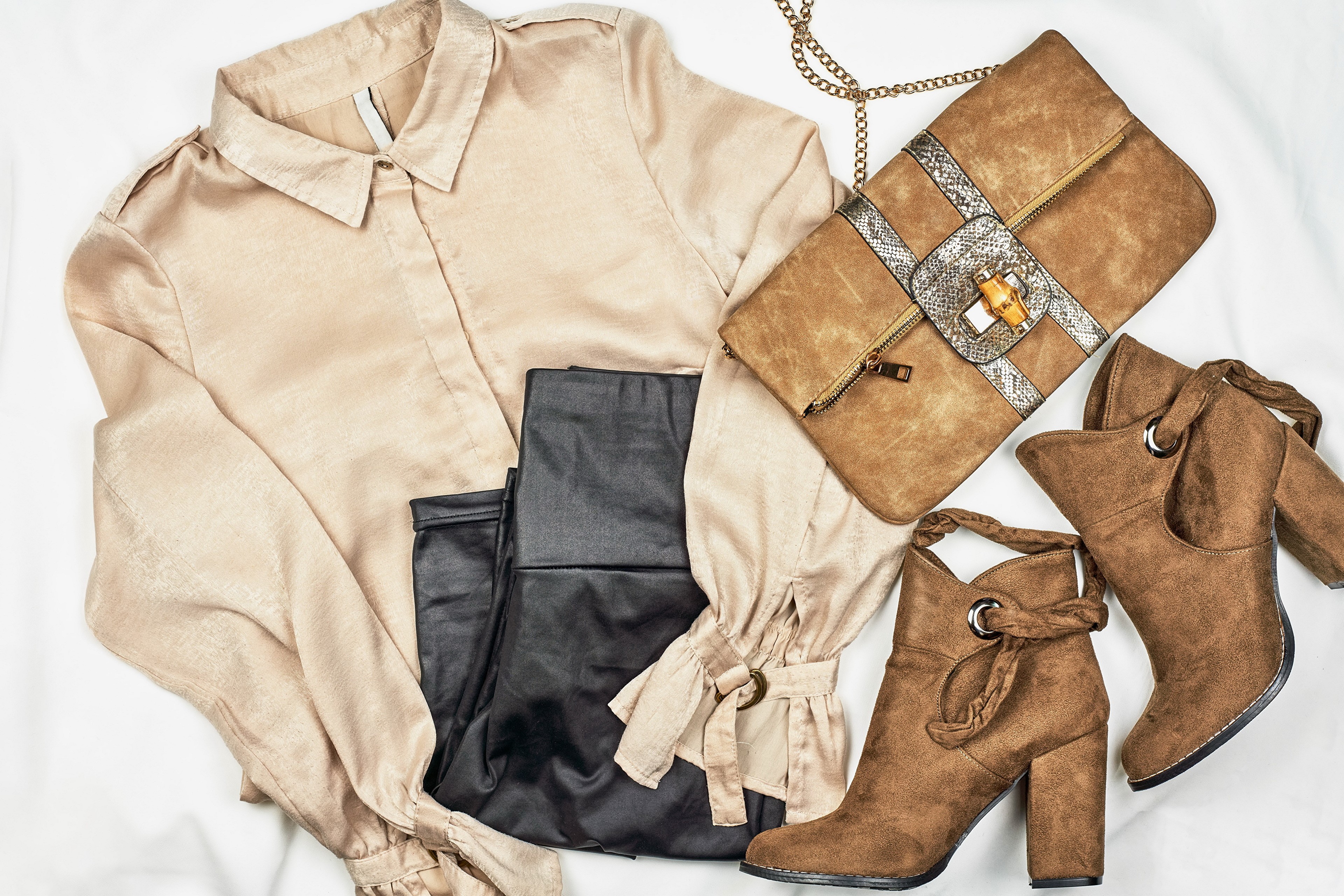 Beige silk shirt, black pants, brown handbag, and brown boots HD Wallpaper