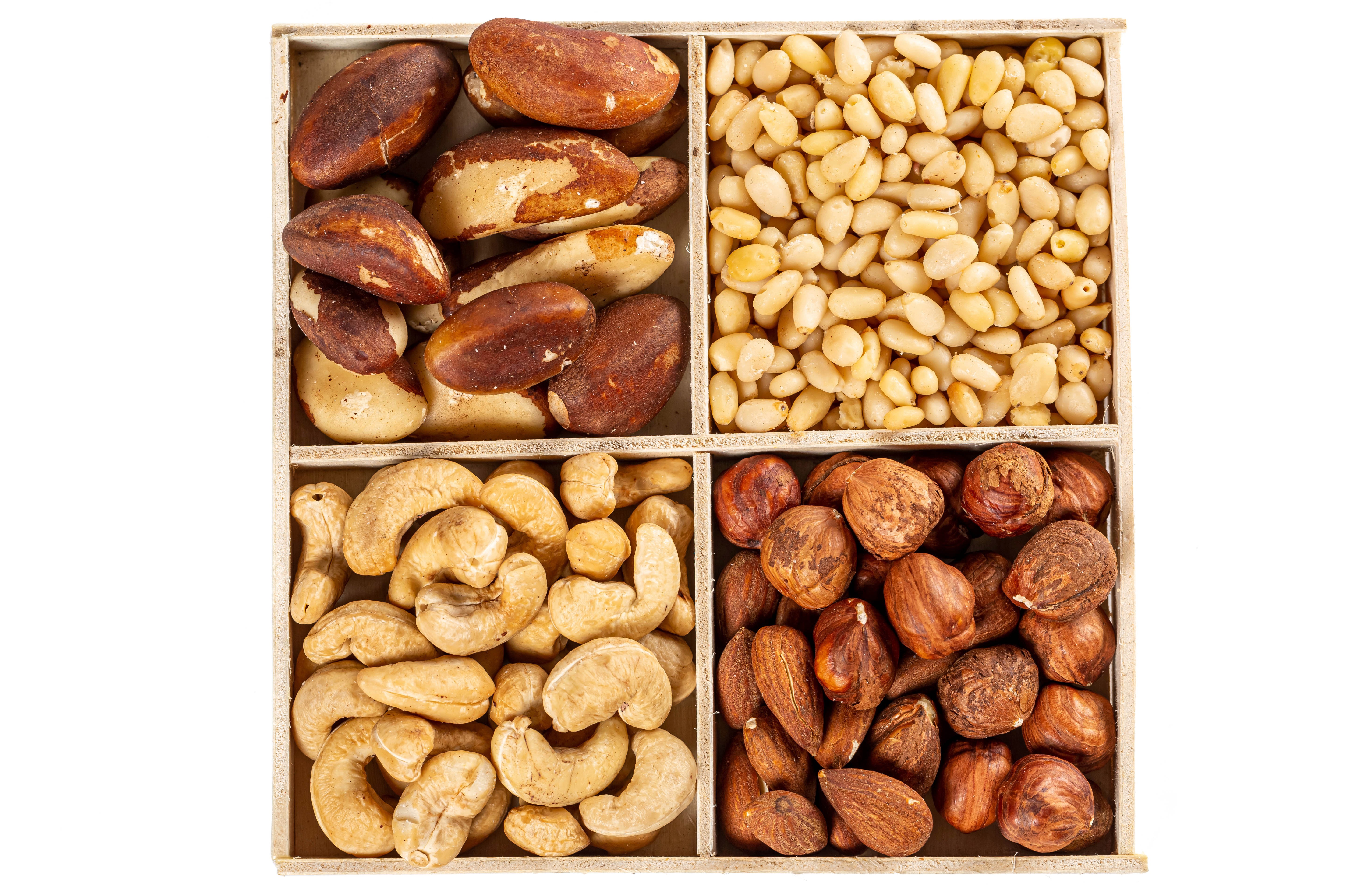 Assortment of Nuts in a Wooden Box HD Wallpaper