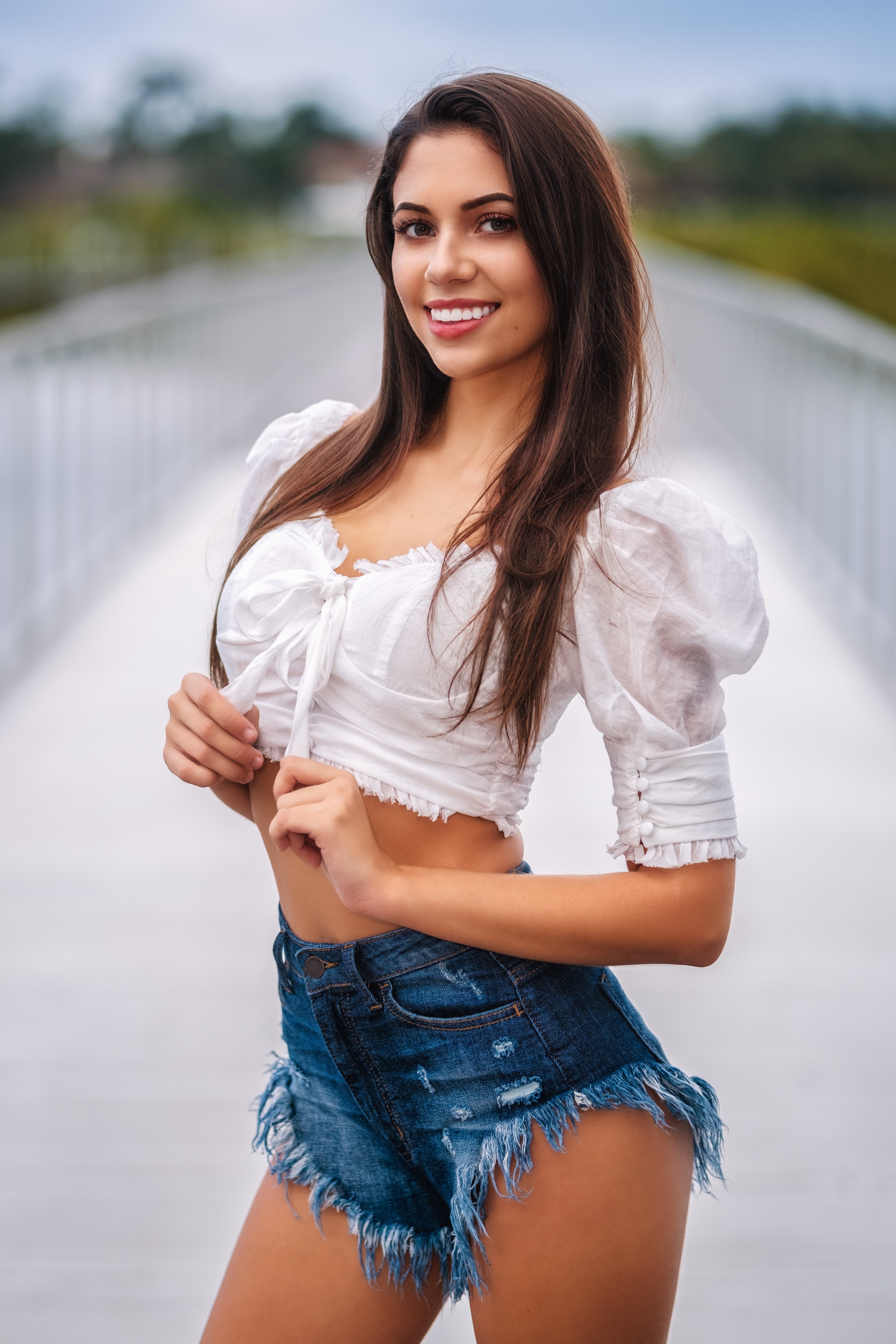 Taylor Smiling in White Blouse and Denim Shorts HD Phone Wallpaper