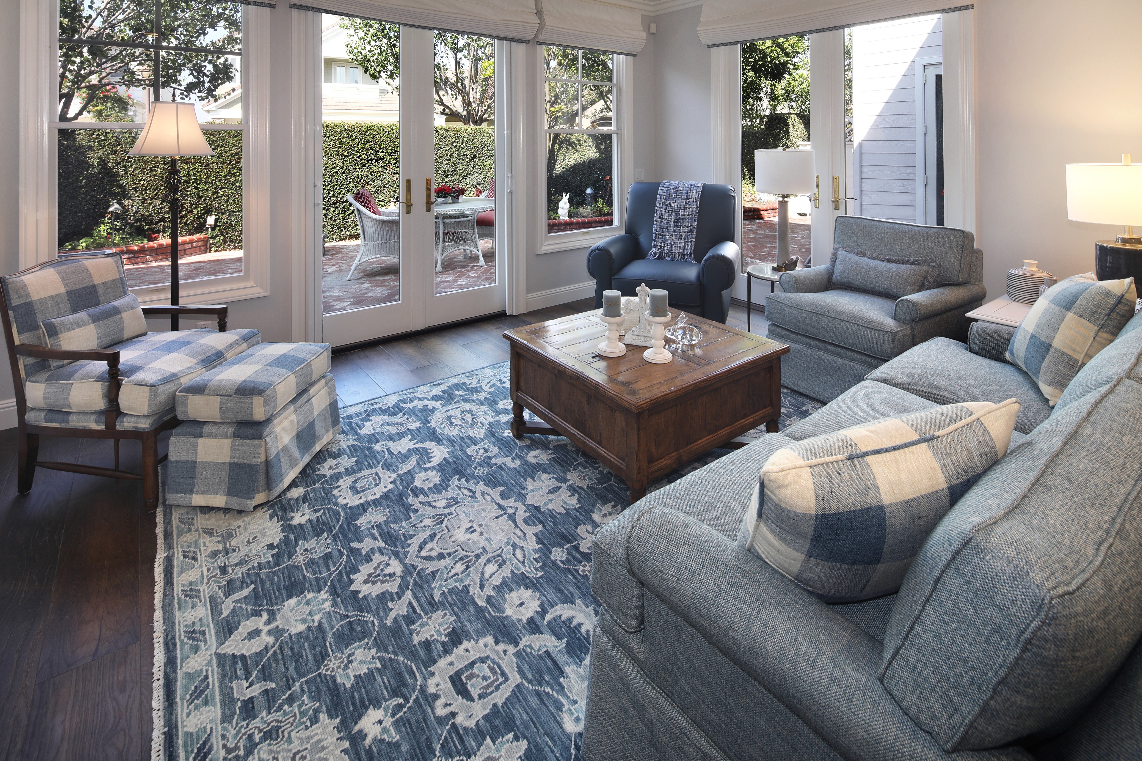 Living room with sofa, armchair, and carpet HD Wallpaper