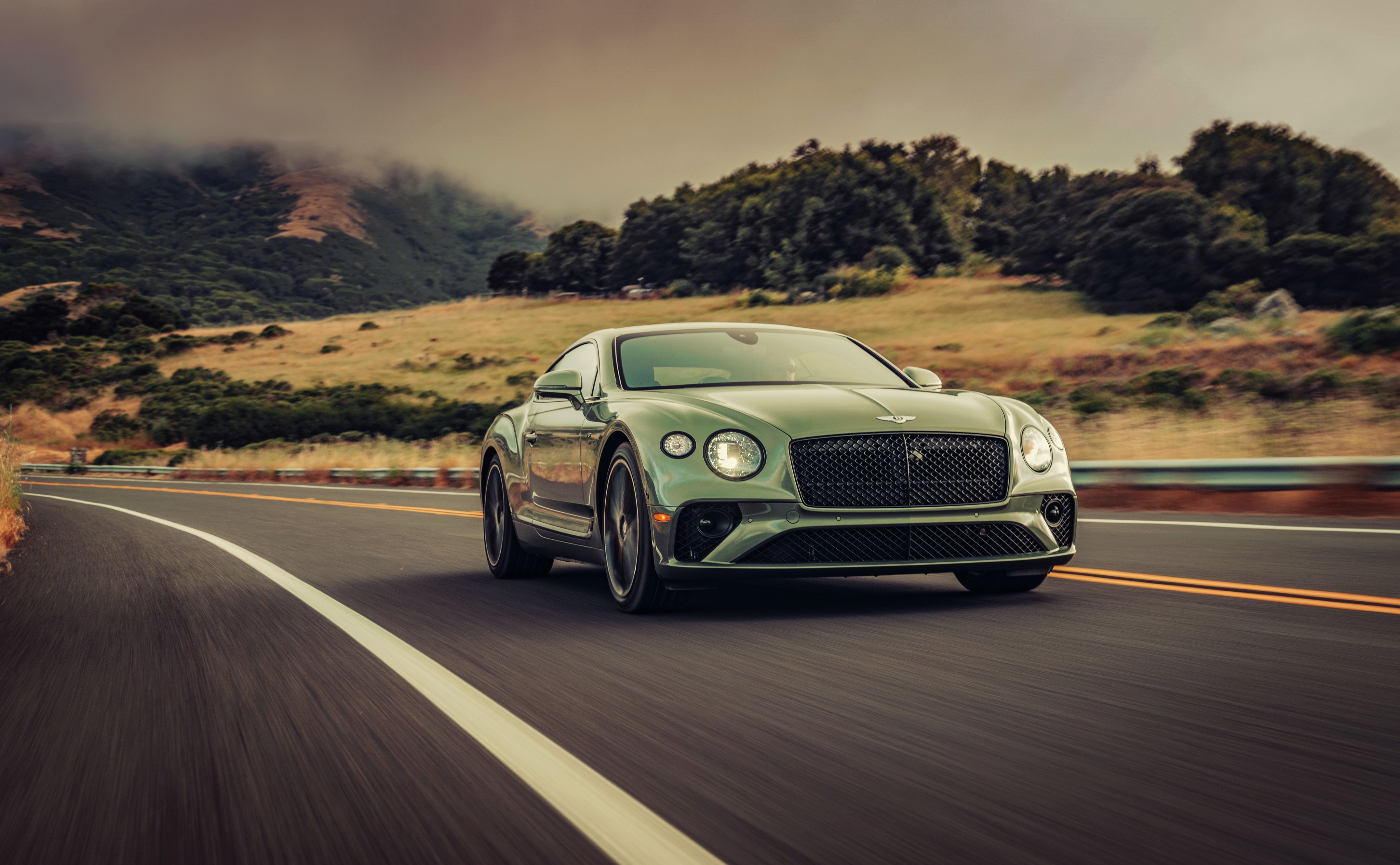 Green 2019 Bentley Continental GT V8 on a road HD Wallpaper