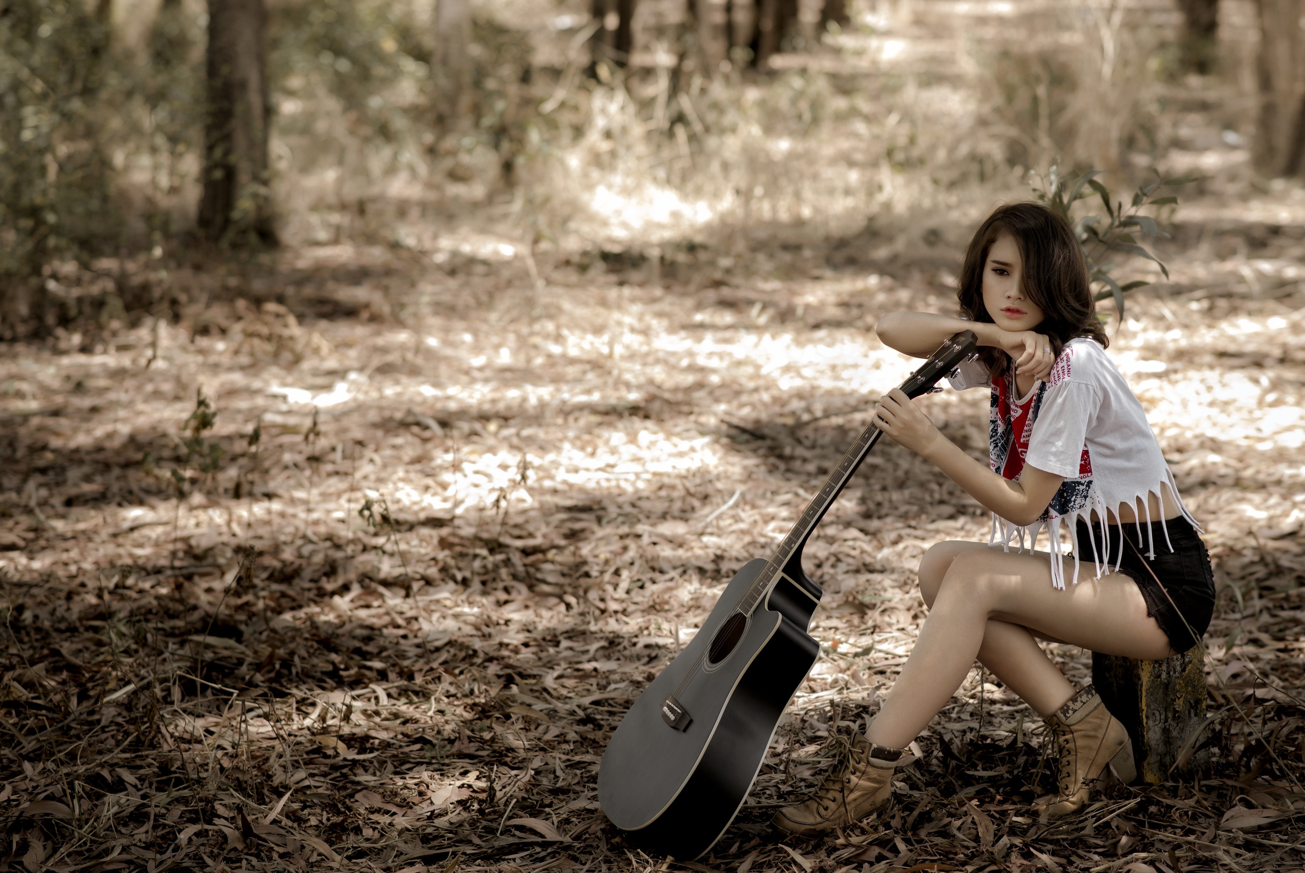 Brunette girl with guitar in forest HD Wallpaper