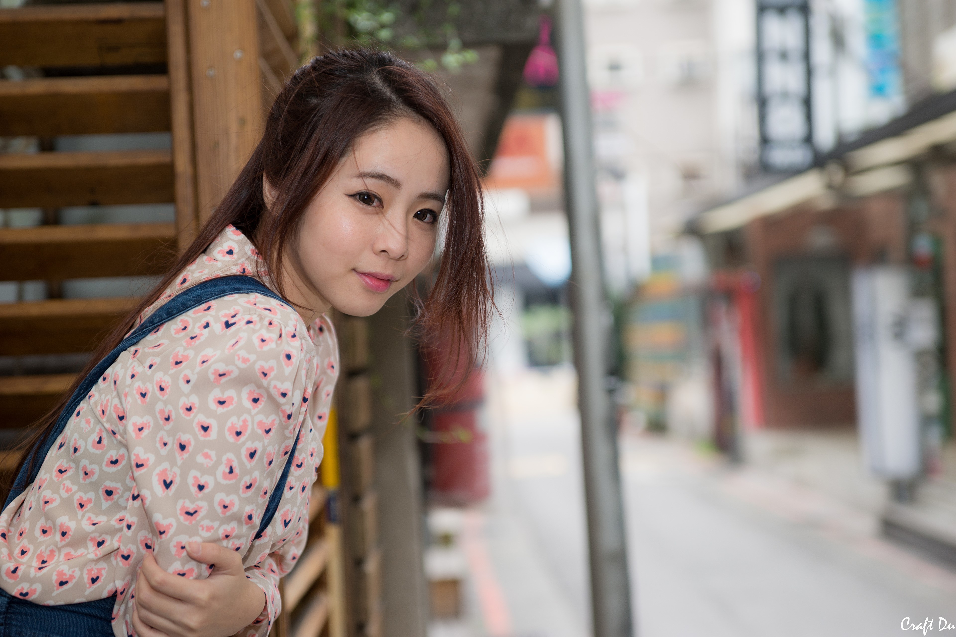 Asian woman with brown hair looking over shoulder HD Wallpaper