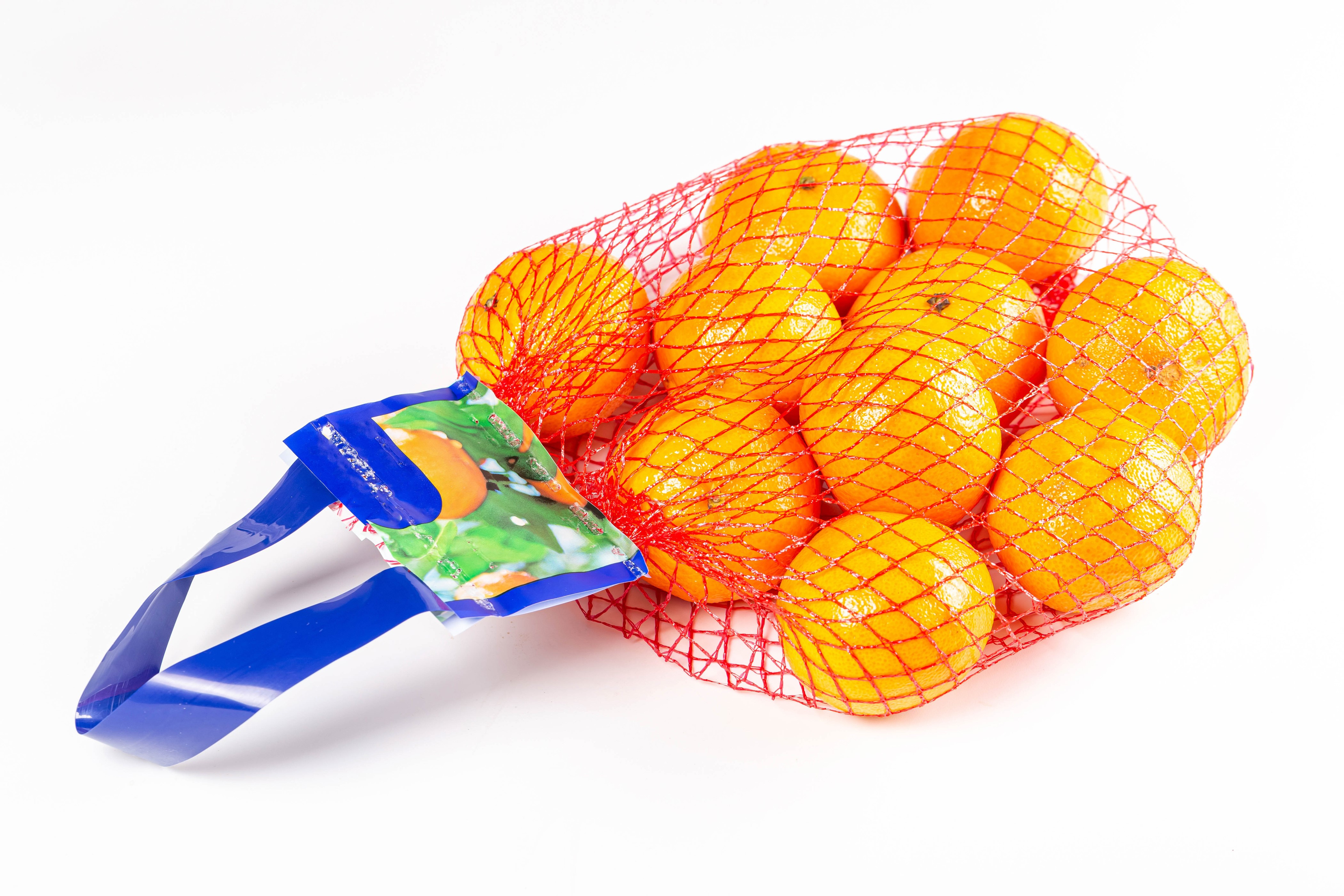 Bag of Mandarins on White Background HD Wallpaper