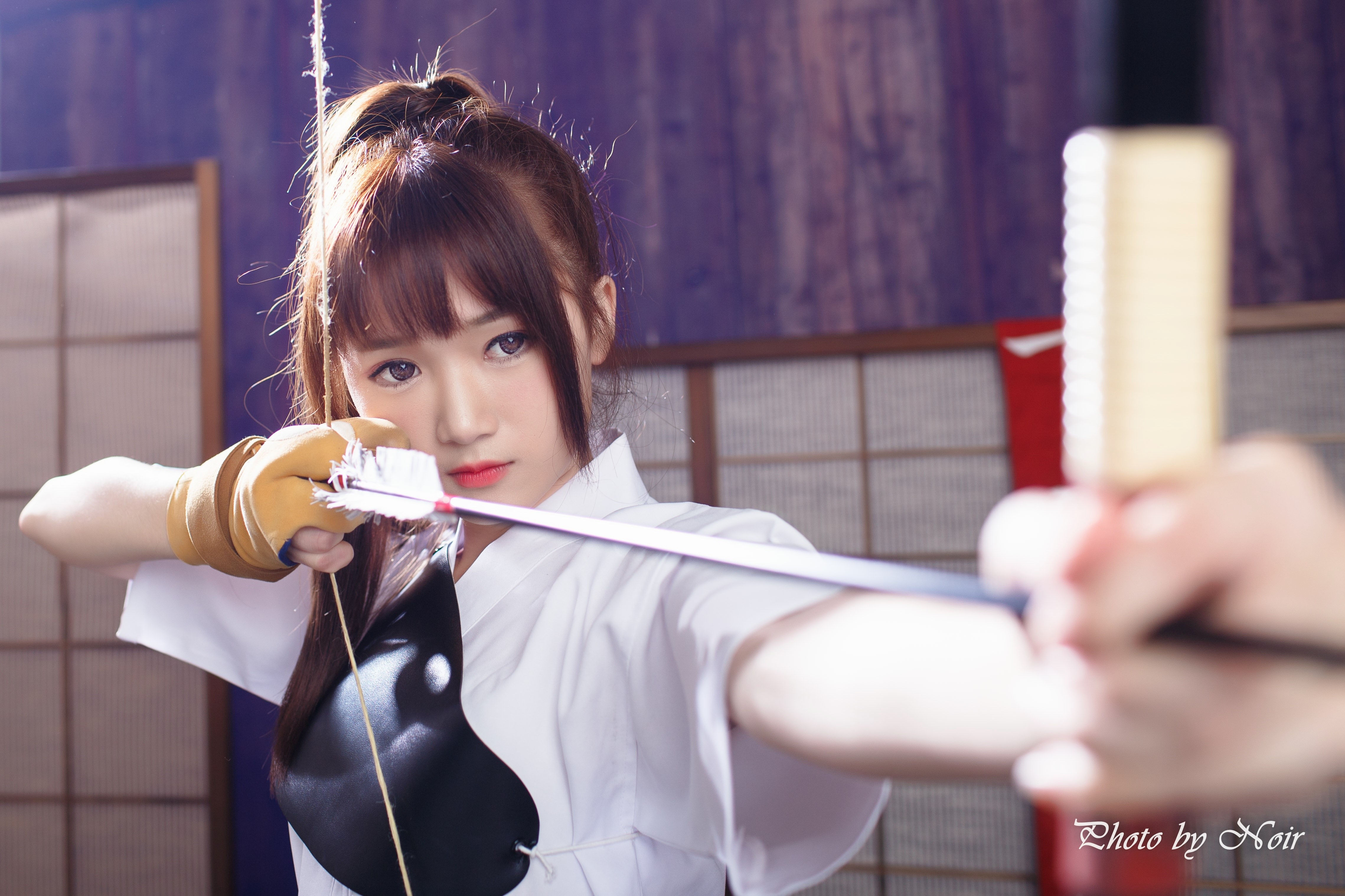 Asian archer with bow and arrow HD Wallpaper
