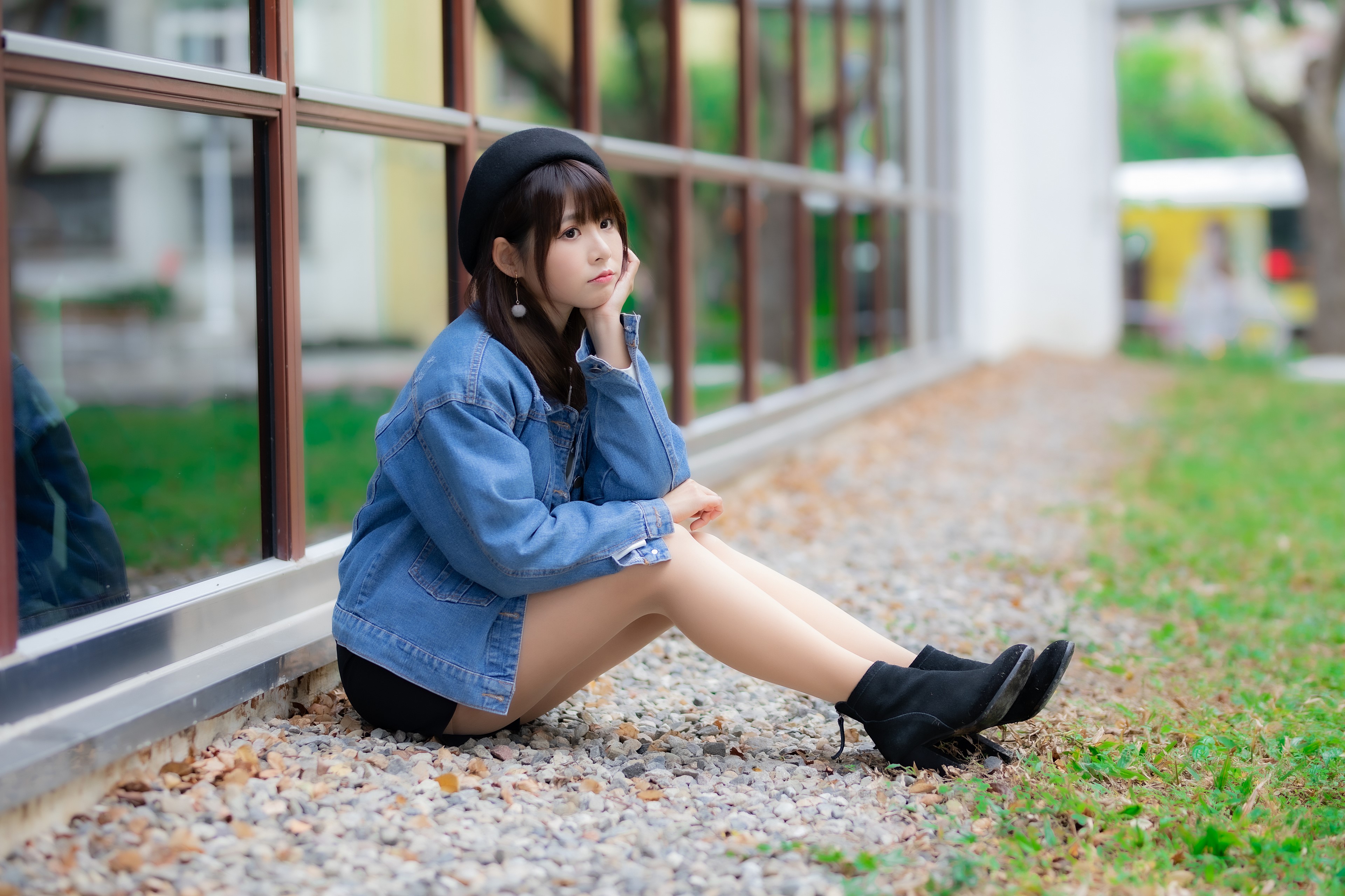 Asian girl in denim jacket and beret sitting outdoors HD Wallpaper