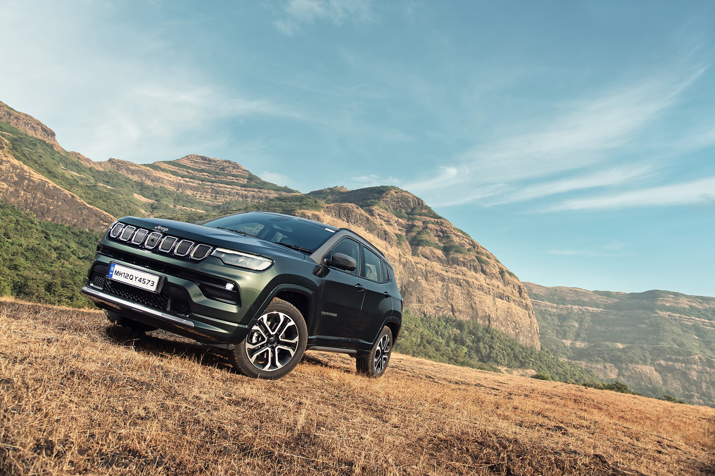 Green Jeep Compass S on a grassy hill HD Wallpaper