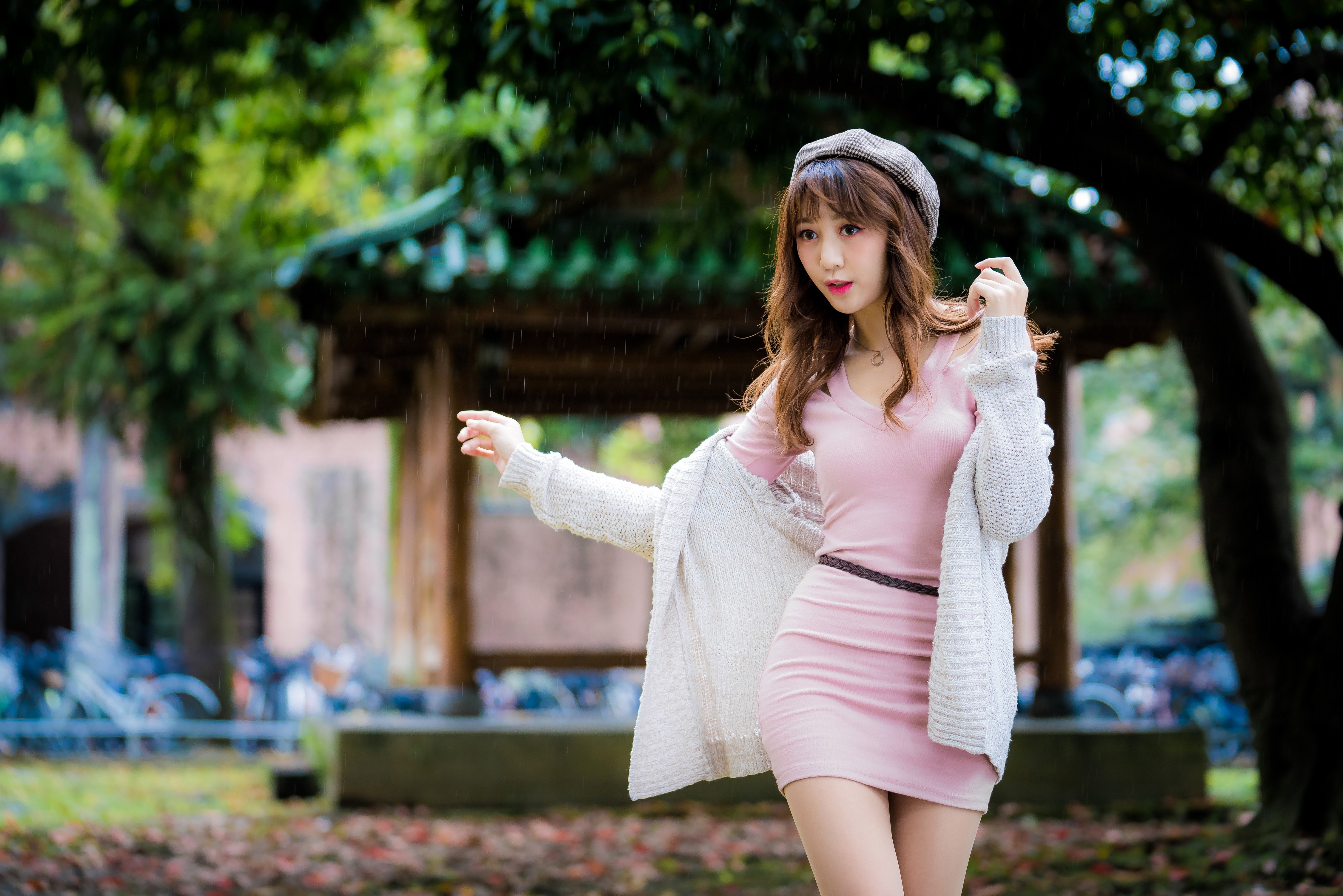 Asian woman in pink dress and beret in the rain HD Wallpaper