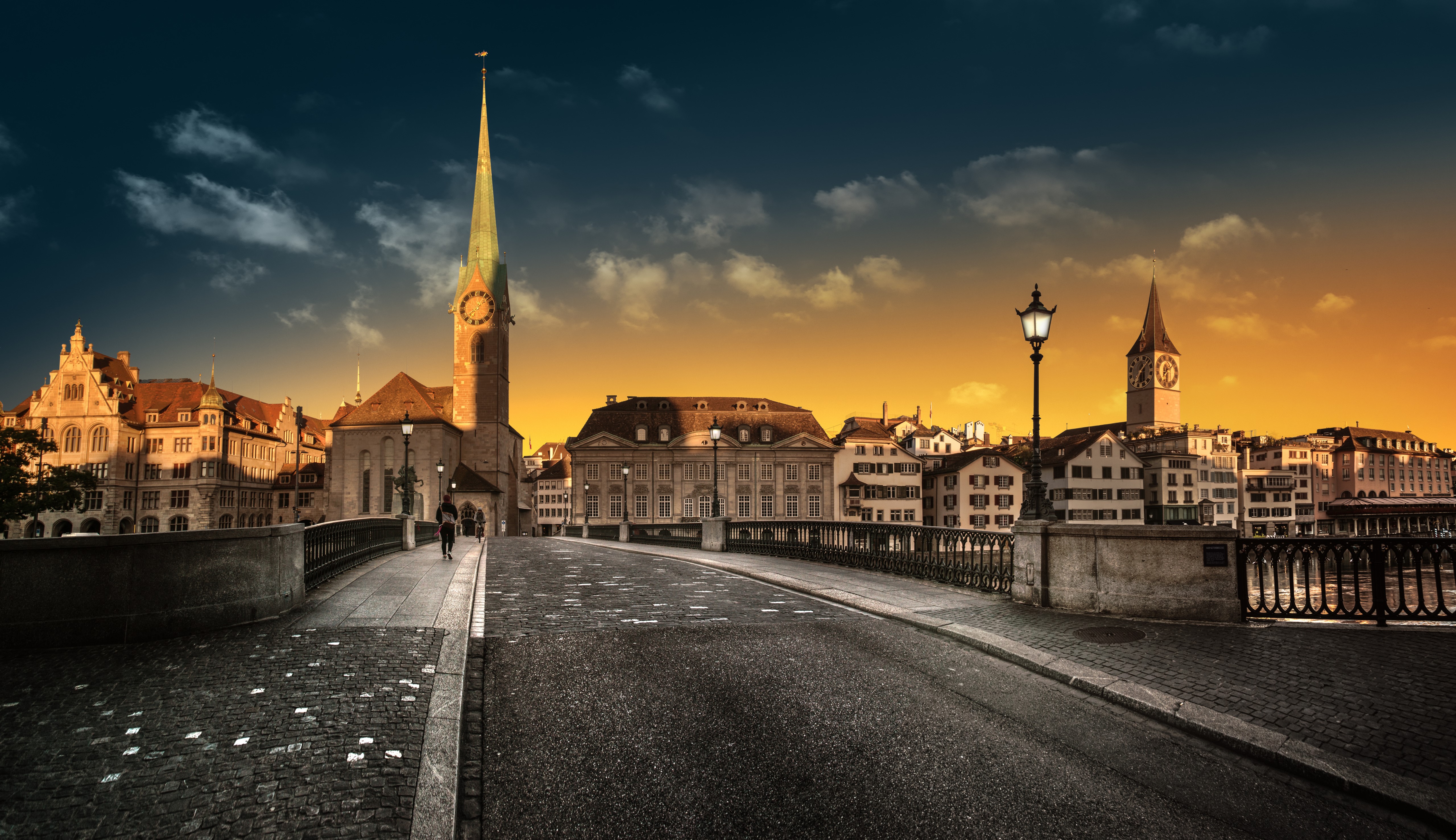 Zurich cityscape with churches and bridge at sunset HD Wallpaper