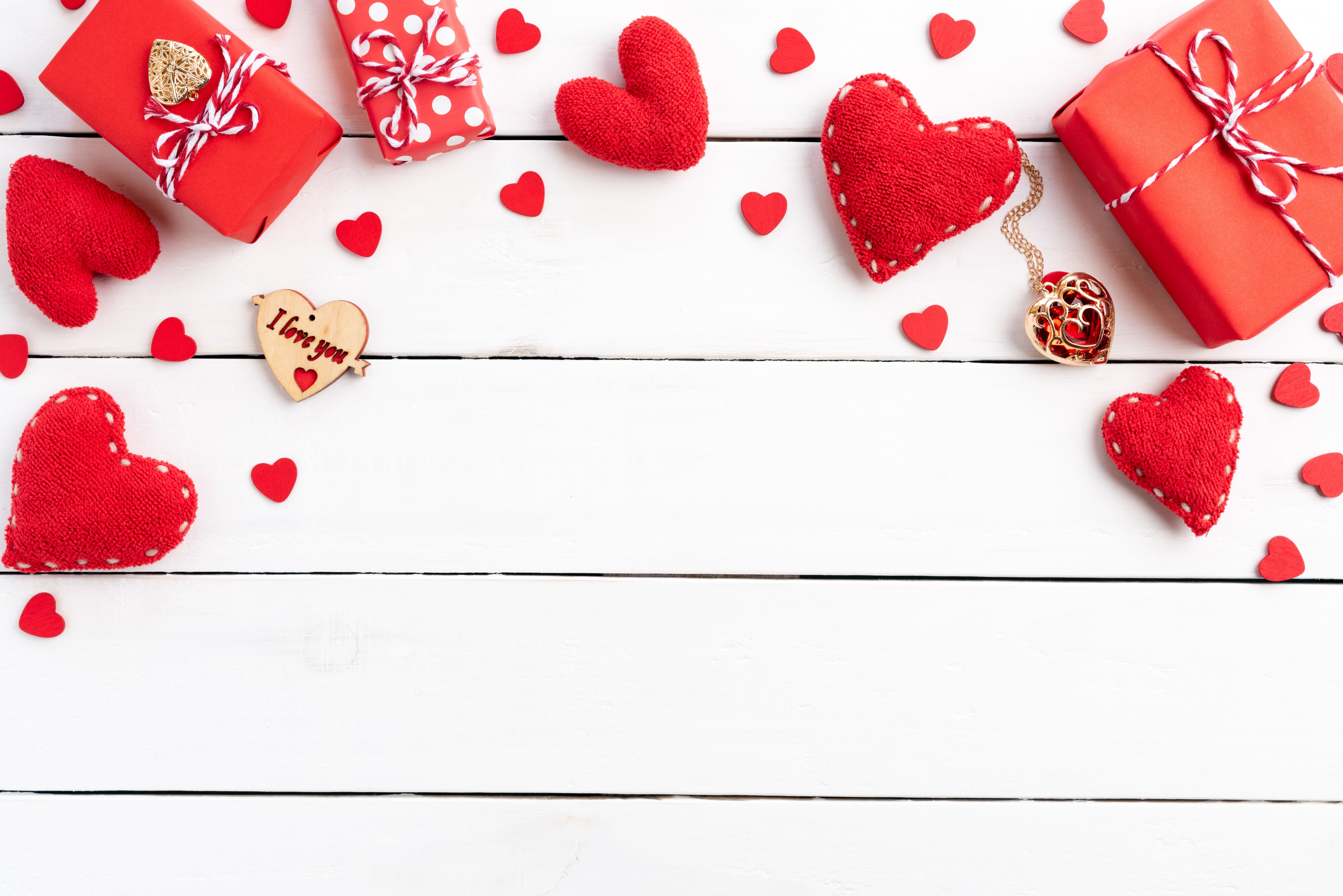 Valentine's Day red hearts and gifts on wood planks HD Wallpaper