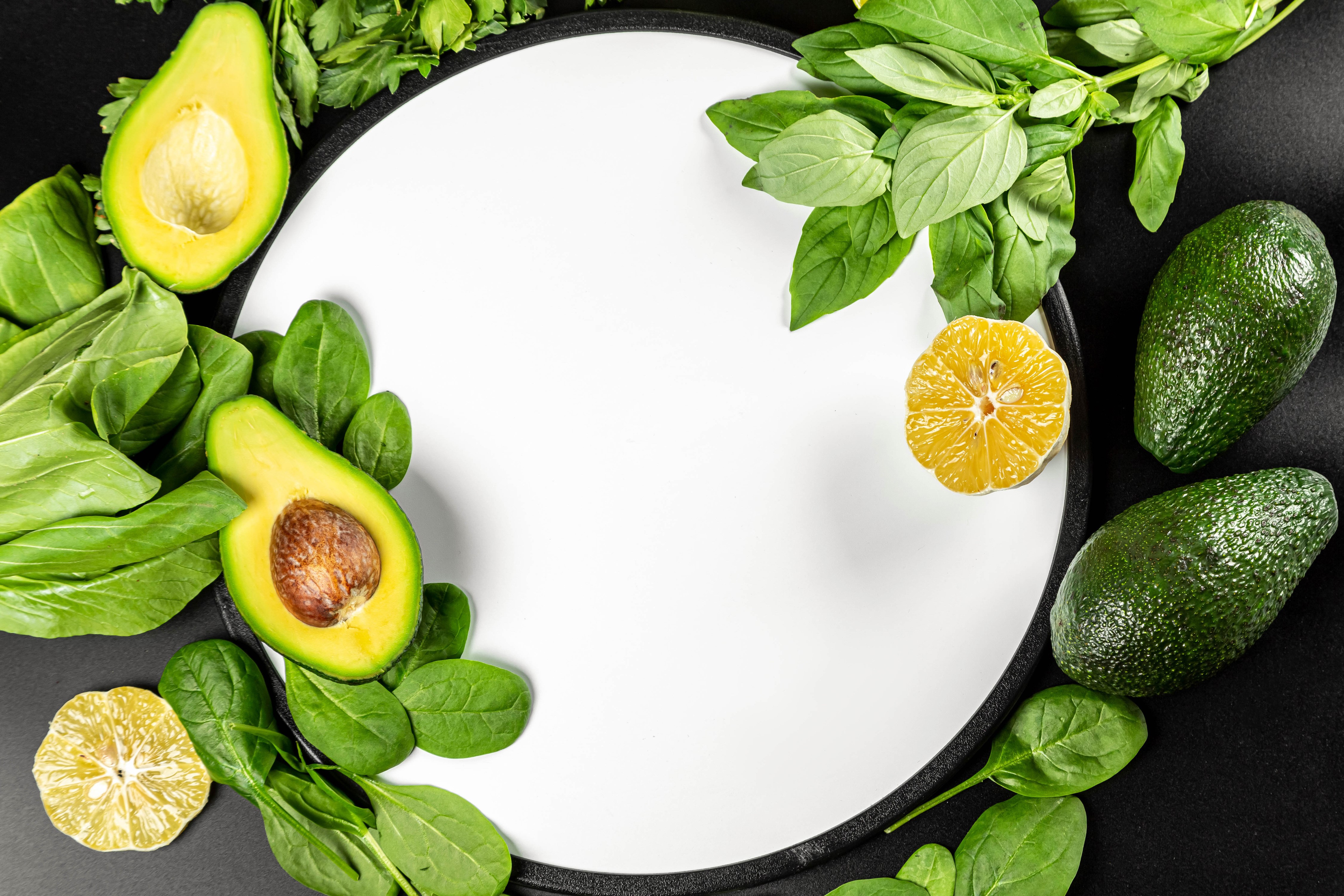 Avocado, Spinach, and Citrus on a White Plate HD Wallpaper