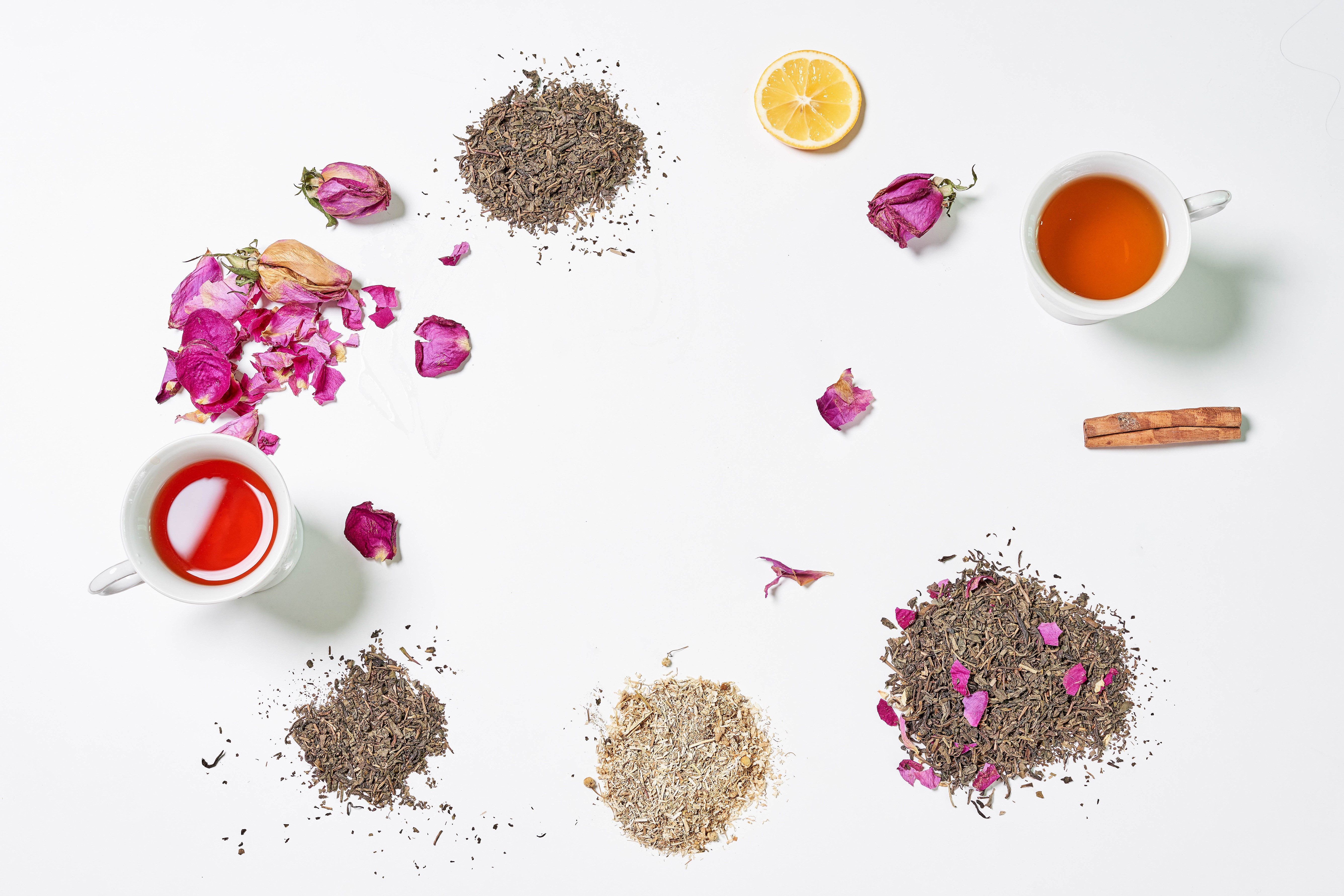 Tea, Cinnamon, Lemon, and Rose Petals on White Background HD Wallpaper