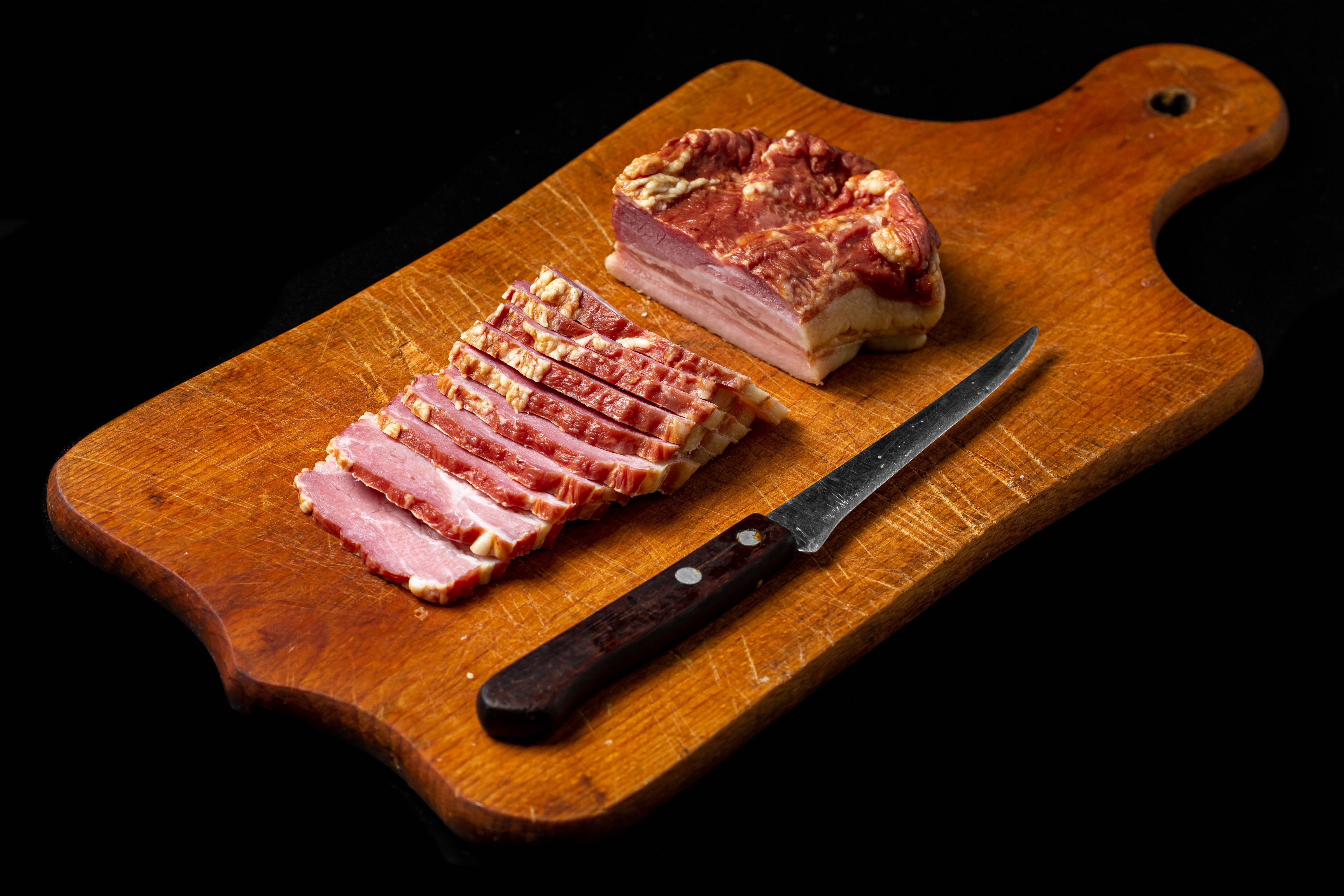 Sliced Ham and Knife on Cutting Board HD Wallpaper