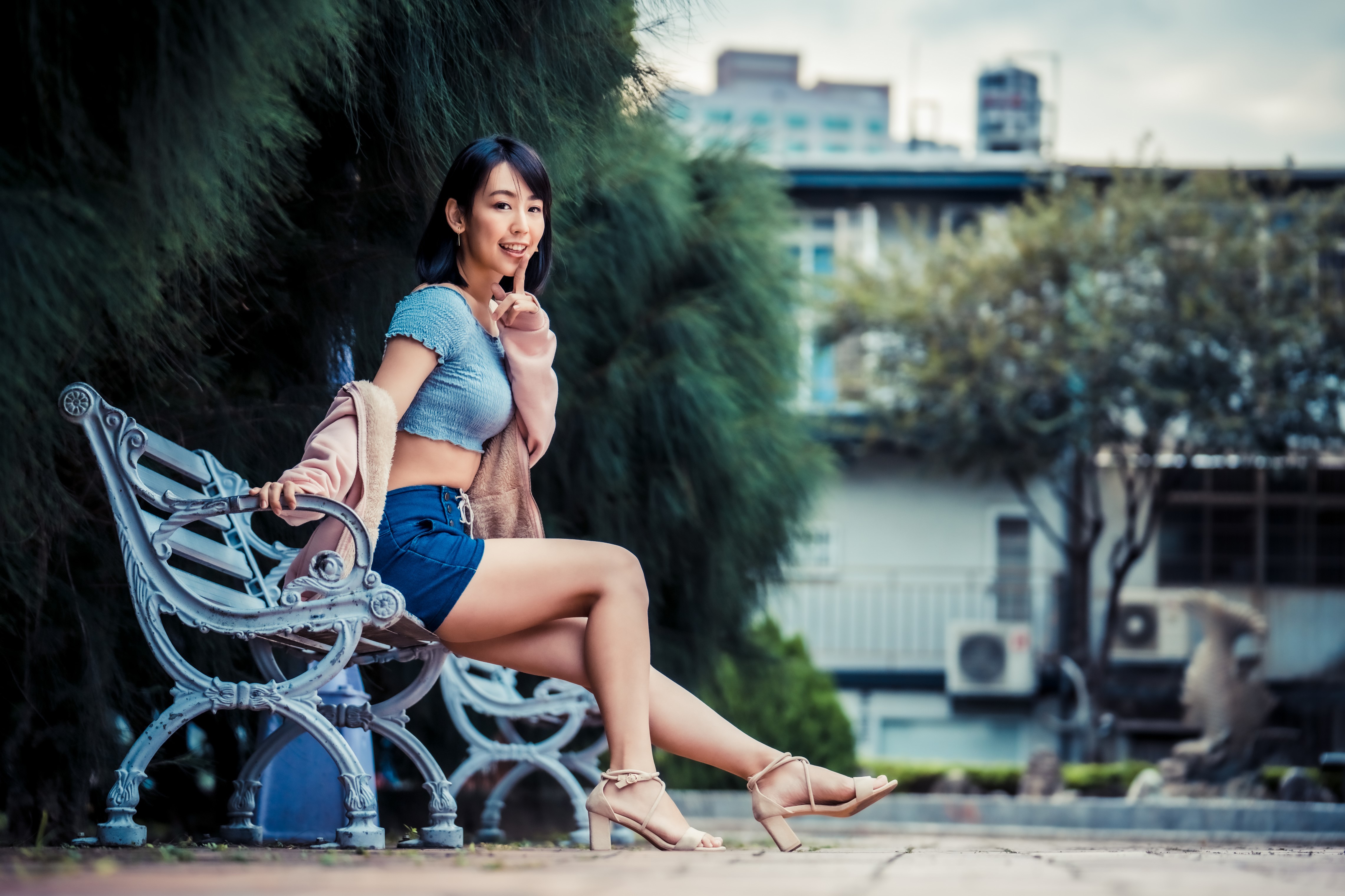 4K Asian Woman Sitting on Bench with Gesture HD Wallpaper